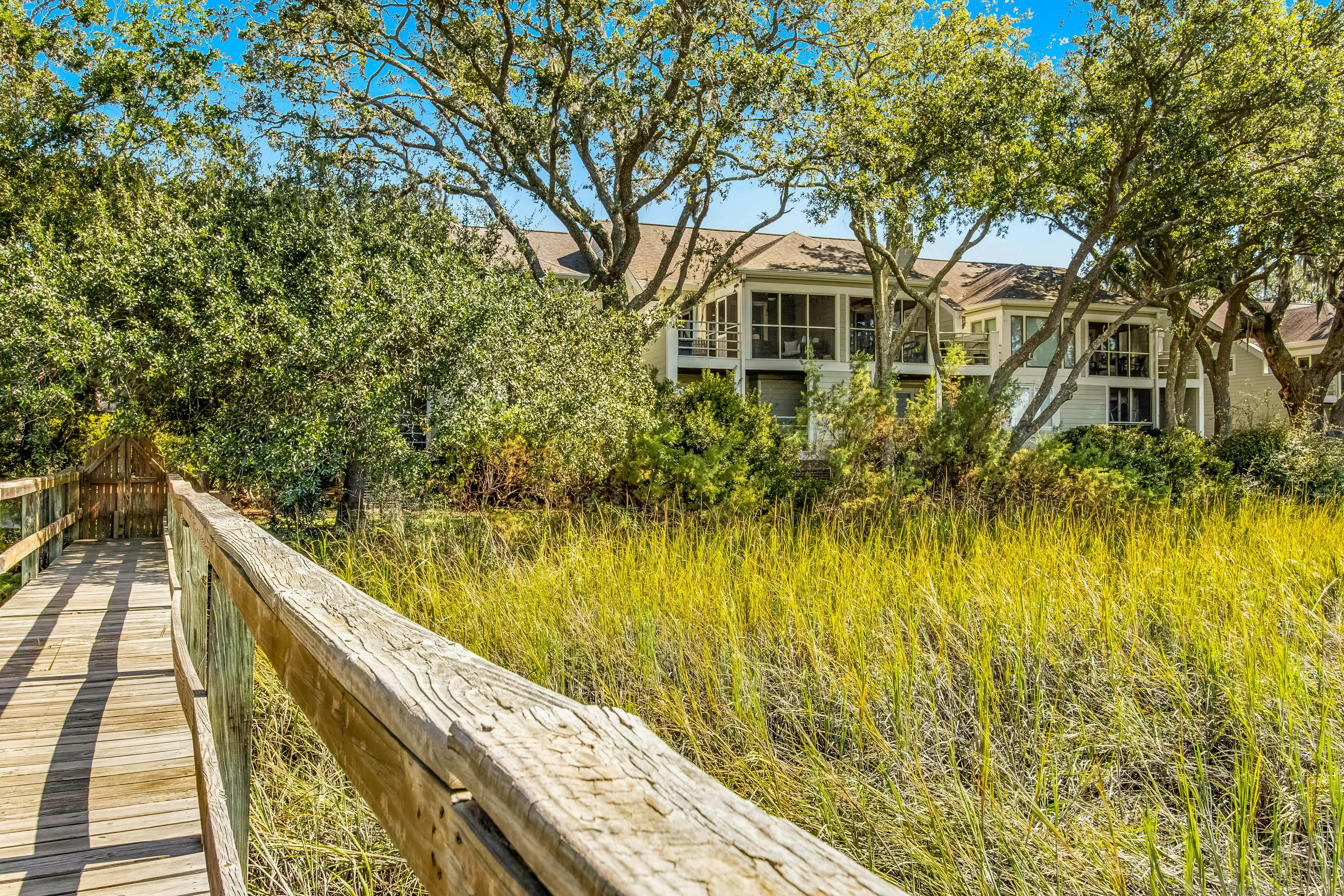 Three-level marsh-front villa with screened porch - walk to all amenities