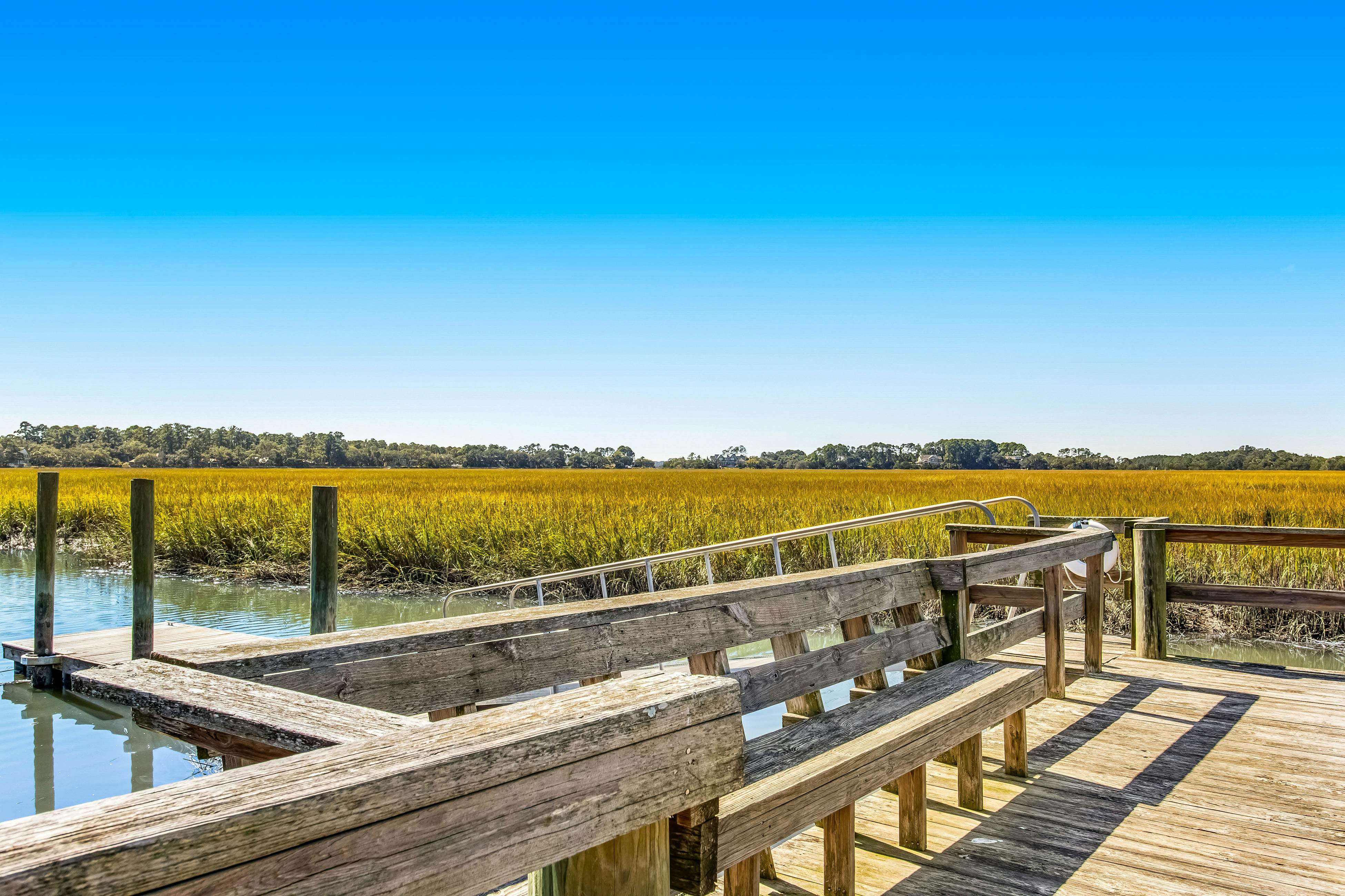 Three-level marsh-front villa with screened porch - walk to all amenities
