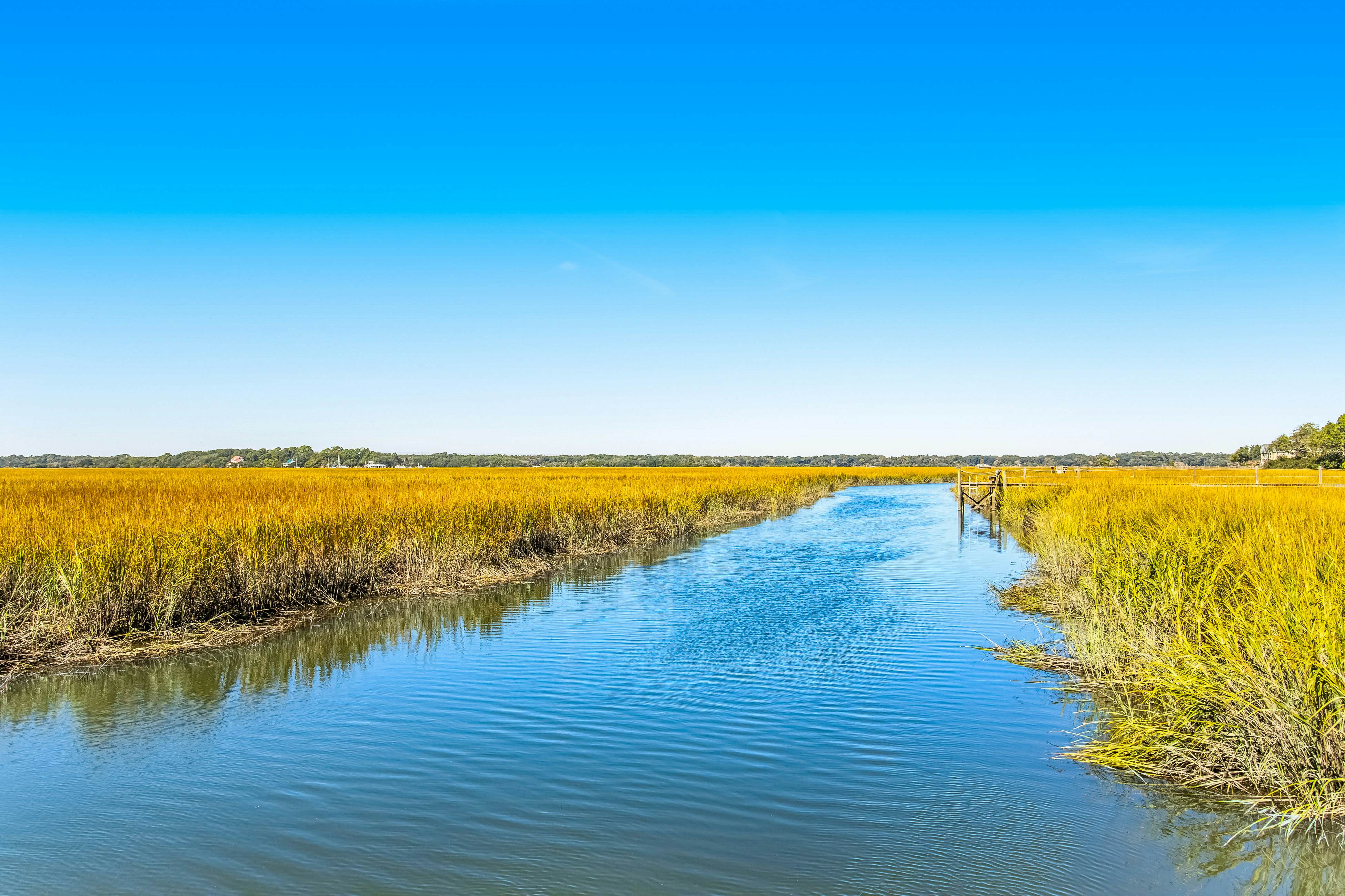 Three-level marsh-front villa with screened porch - walk to all amenities