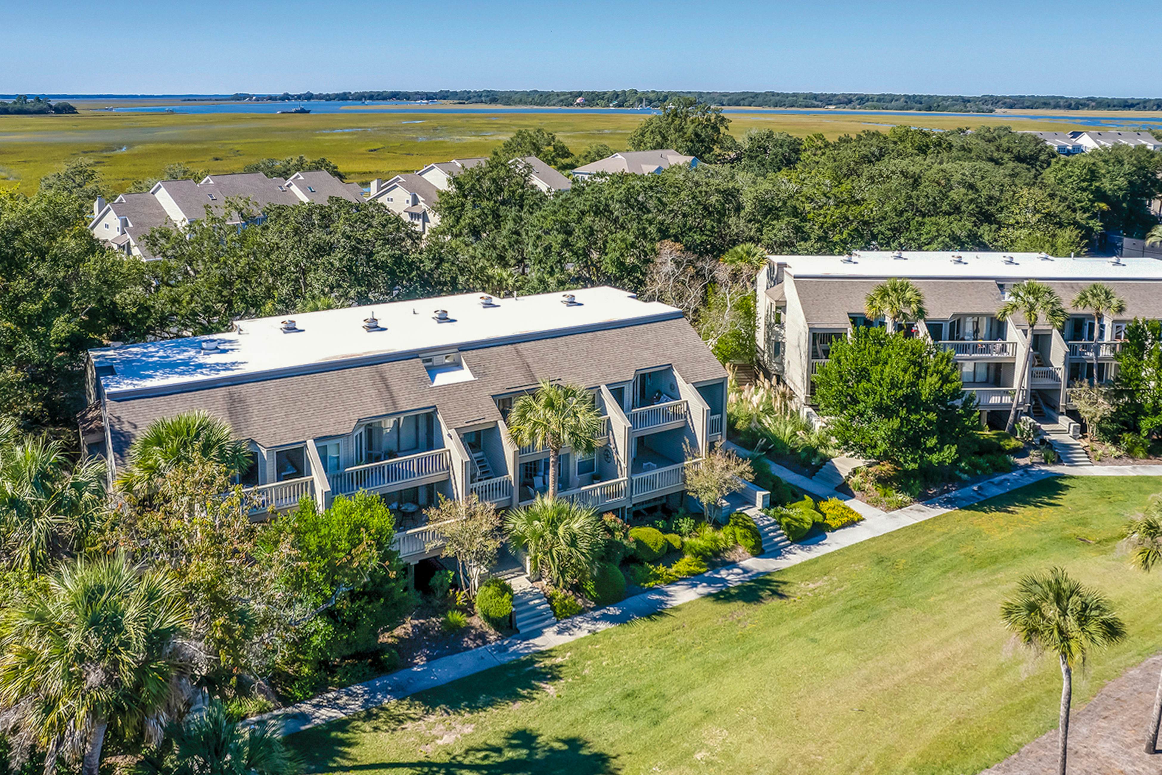 Lovely condo near beach with enclosed porch, pool, tennis, and golf access