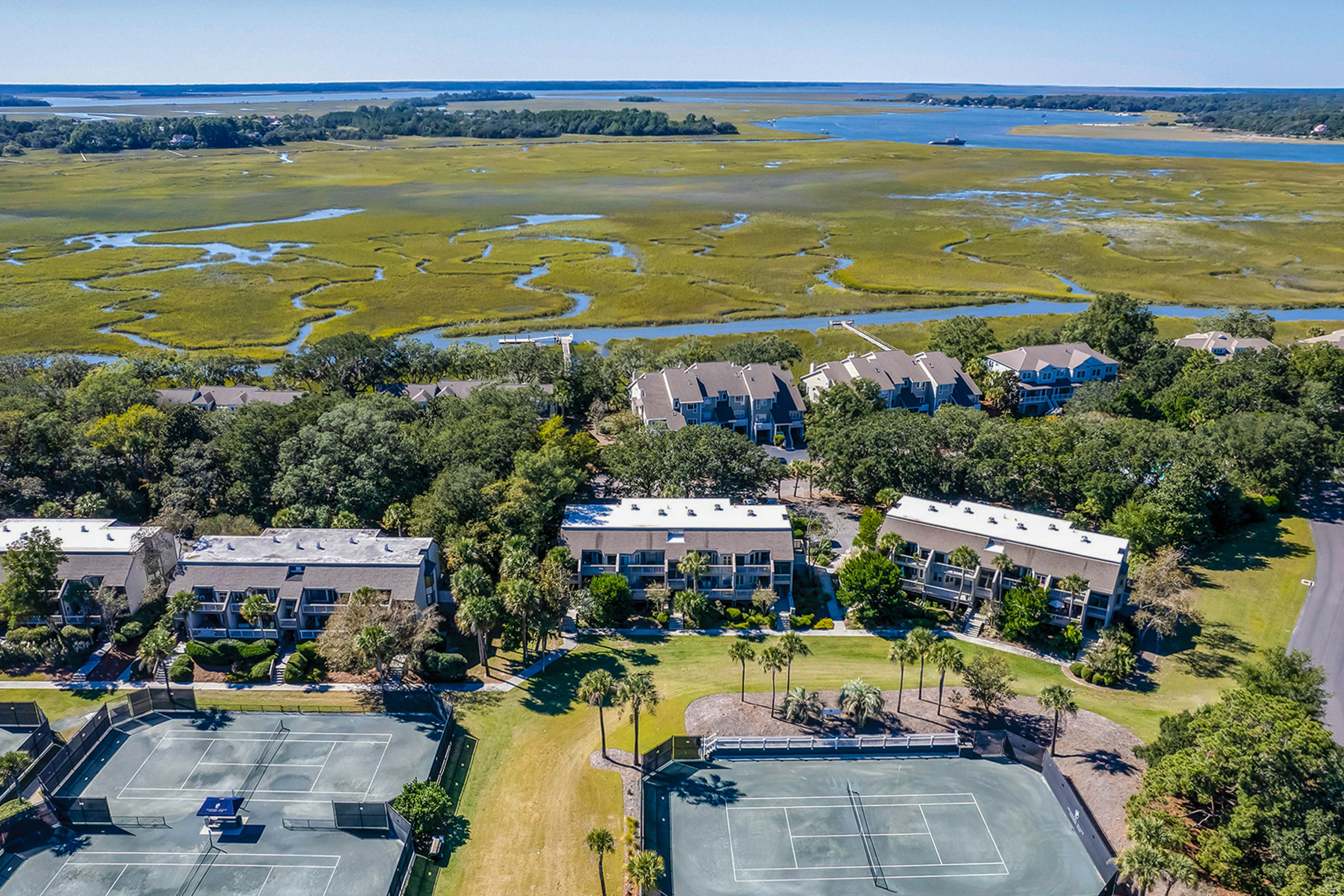 Lovely condo near beach with enclosed porch, pool, tennis, and golf access