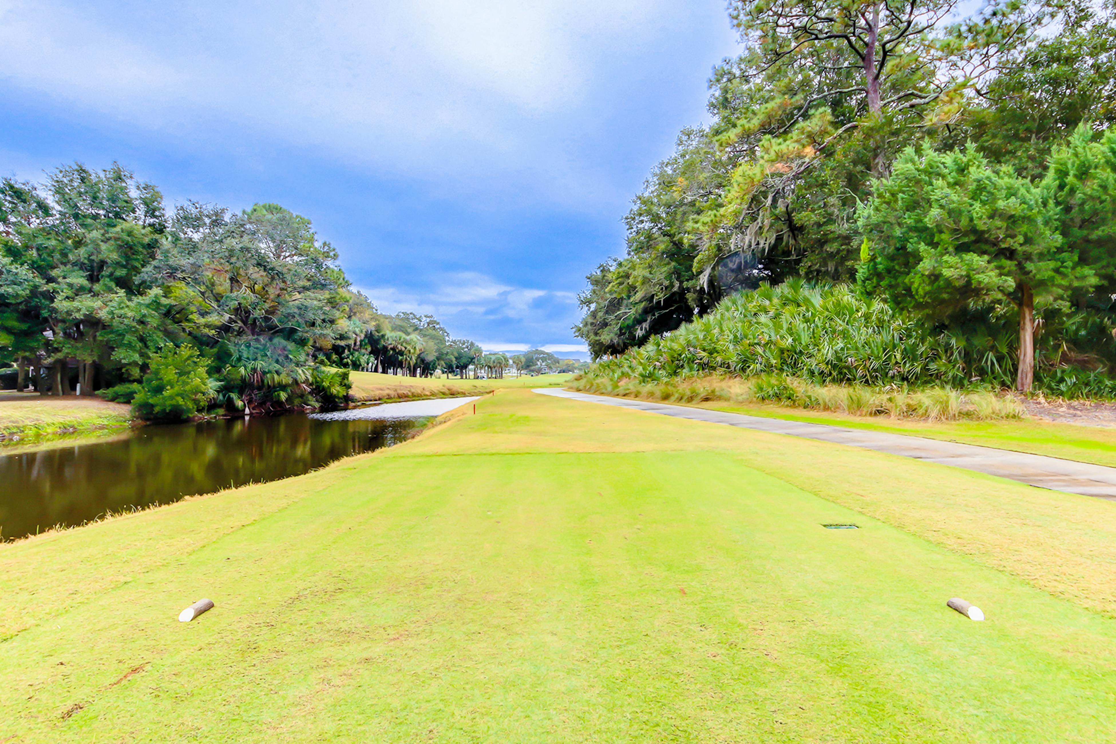 Golf-and-sea villa within walking distance of beach + resort amenities