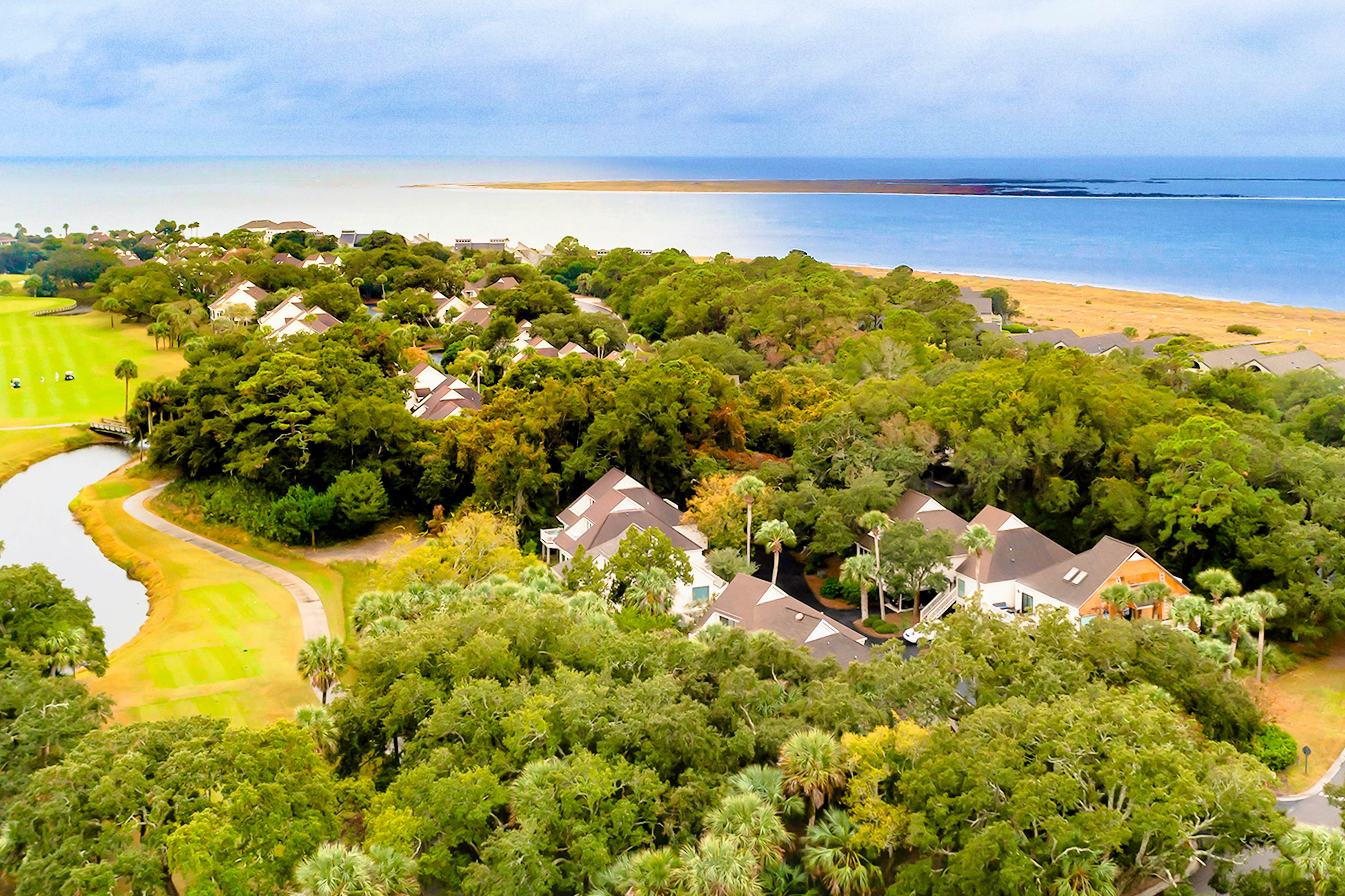 Golf-and-sea villa within walking distance of beach + resort amenities