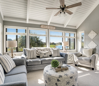 Stylish beach villa with three decks, and golf course views