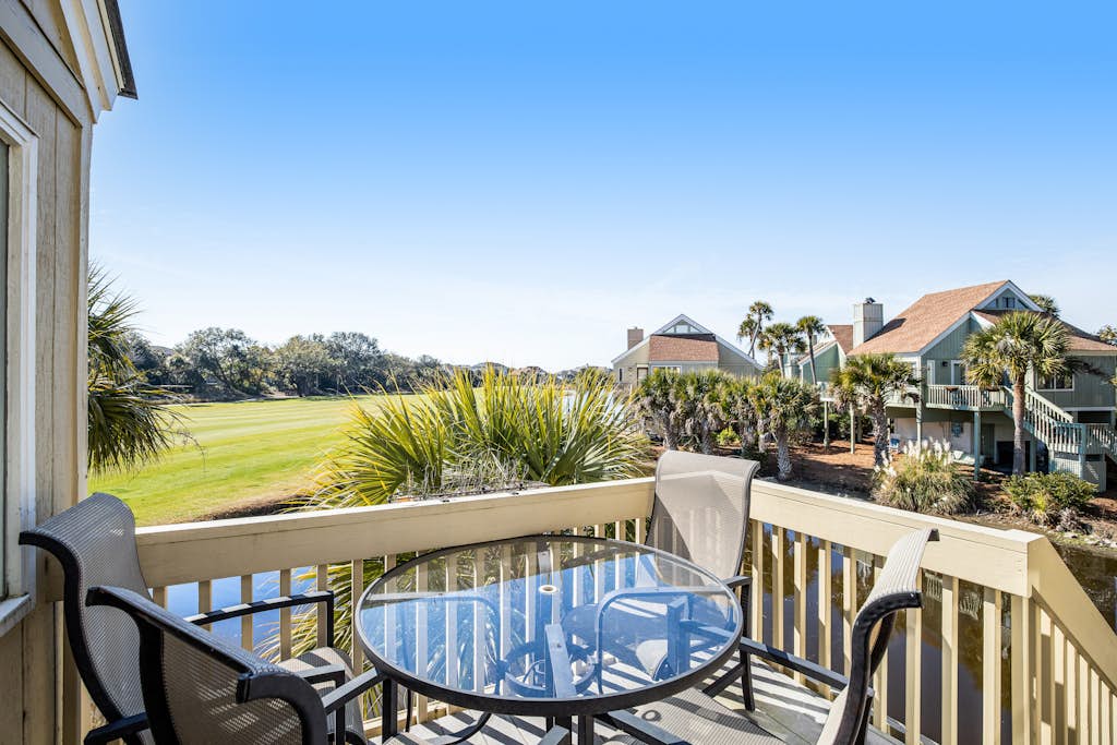 Stylish beach villa with three decks, and golf course views