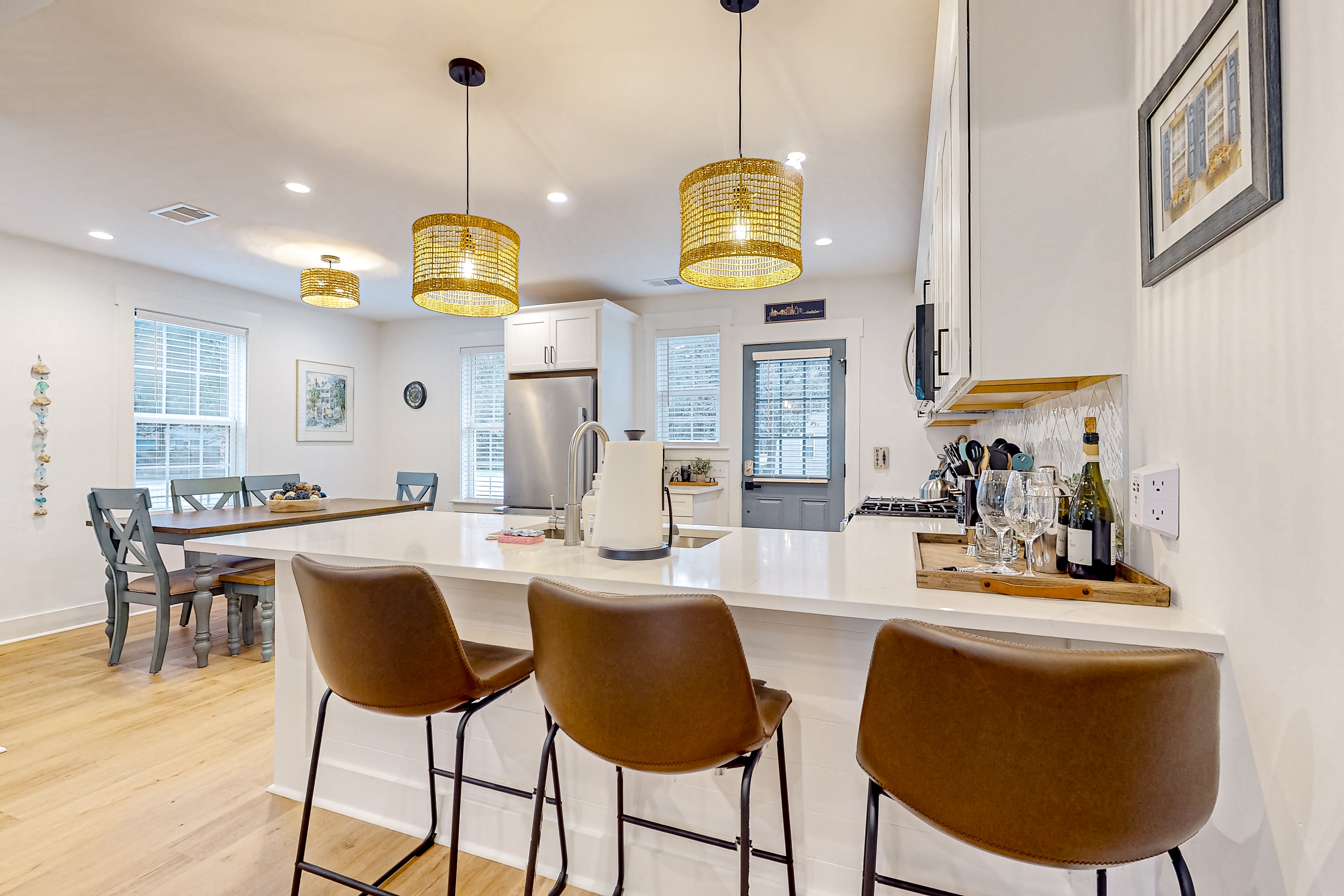 Renovated charmer with chef's kitchen, front porch, work desk, AC, & firepit