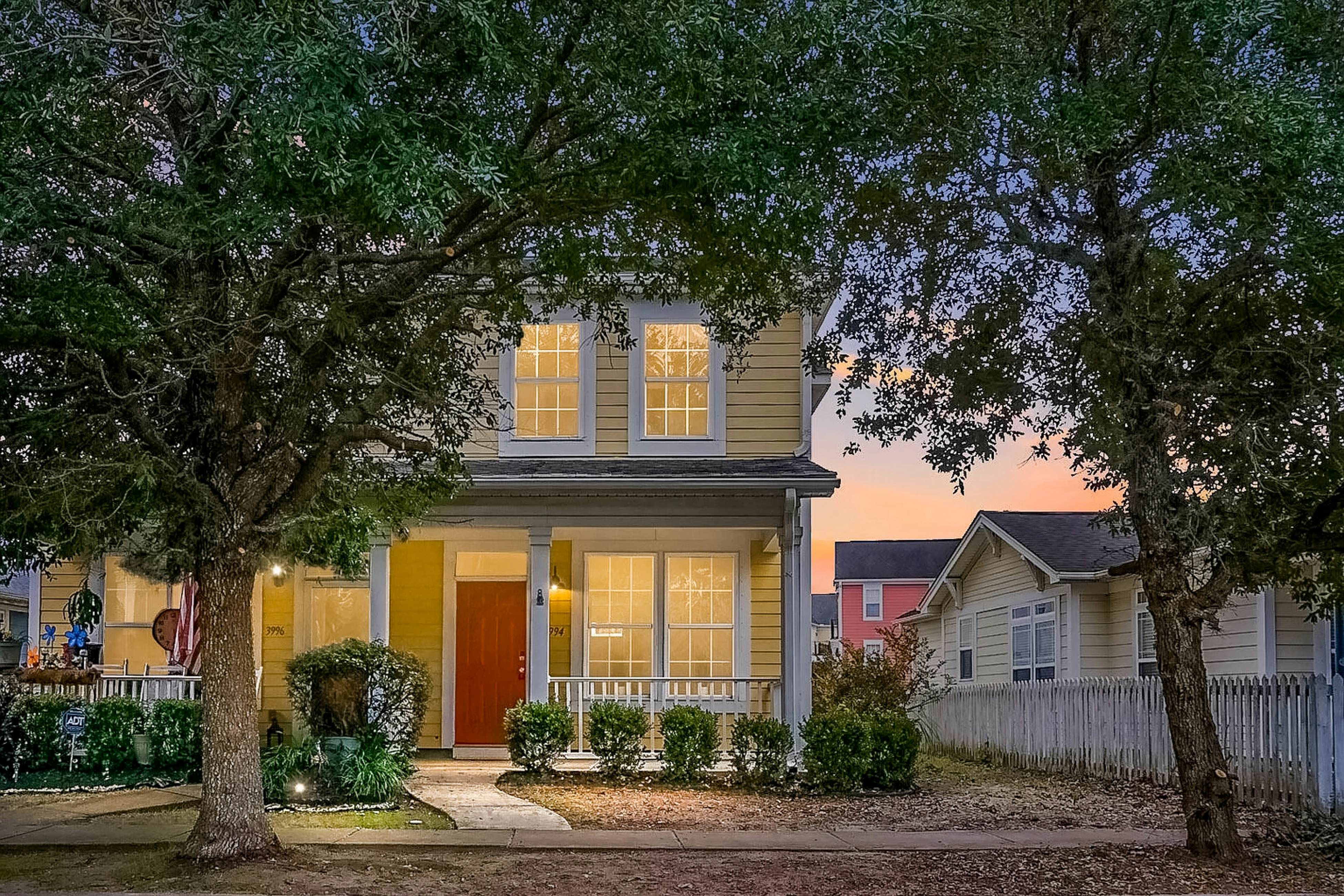 Quintessential townhome with front porch & location near dining & airport