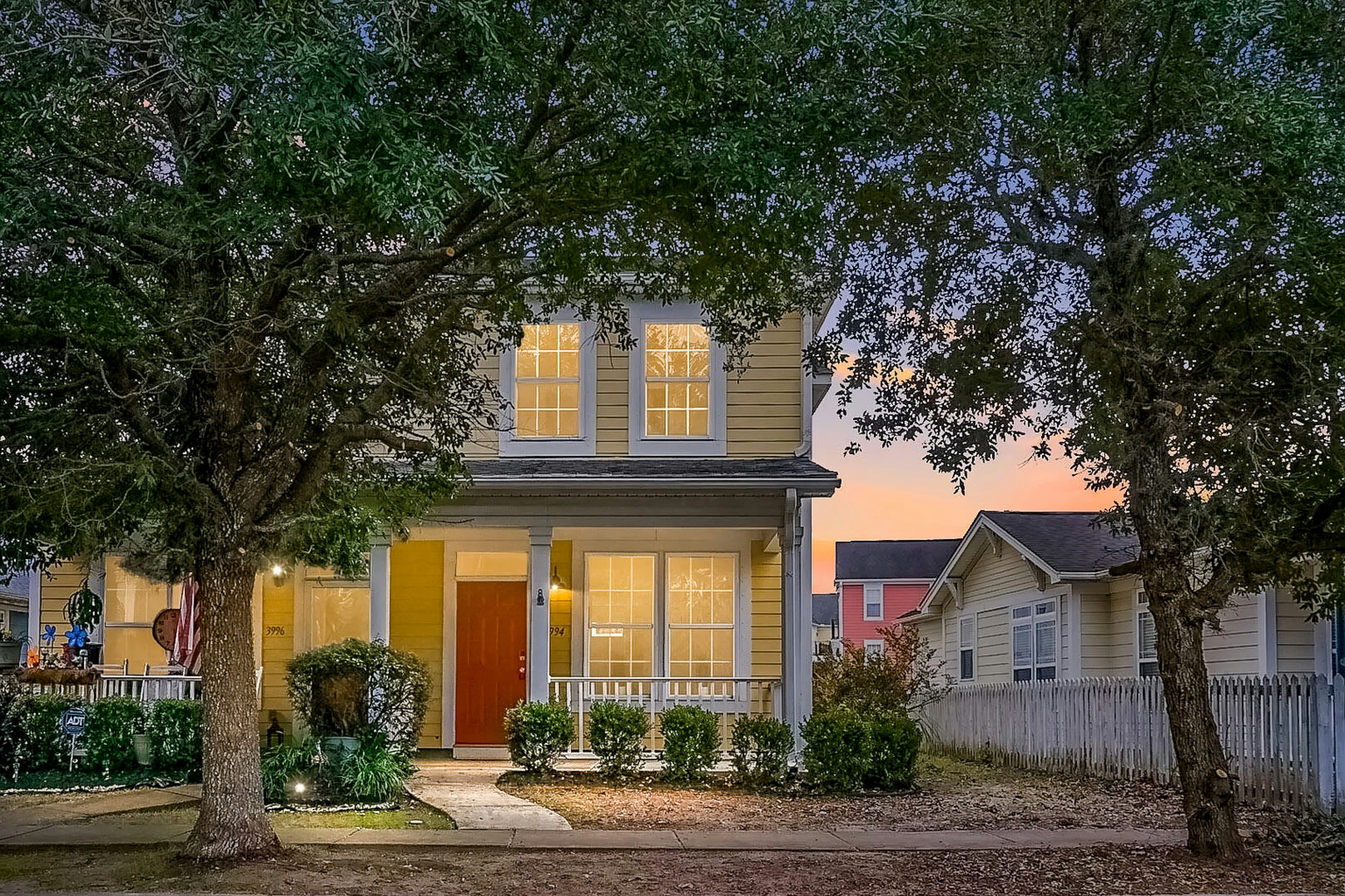 Quintessential townhome with front porch & location near dining & airport
