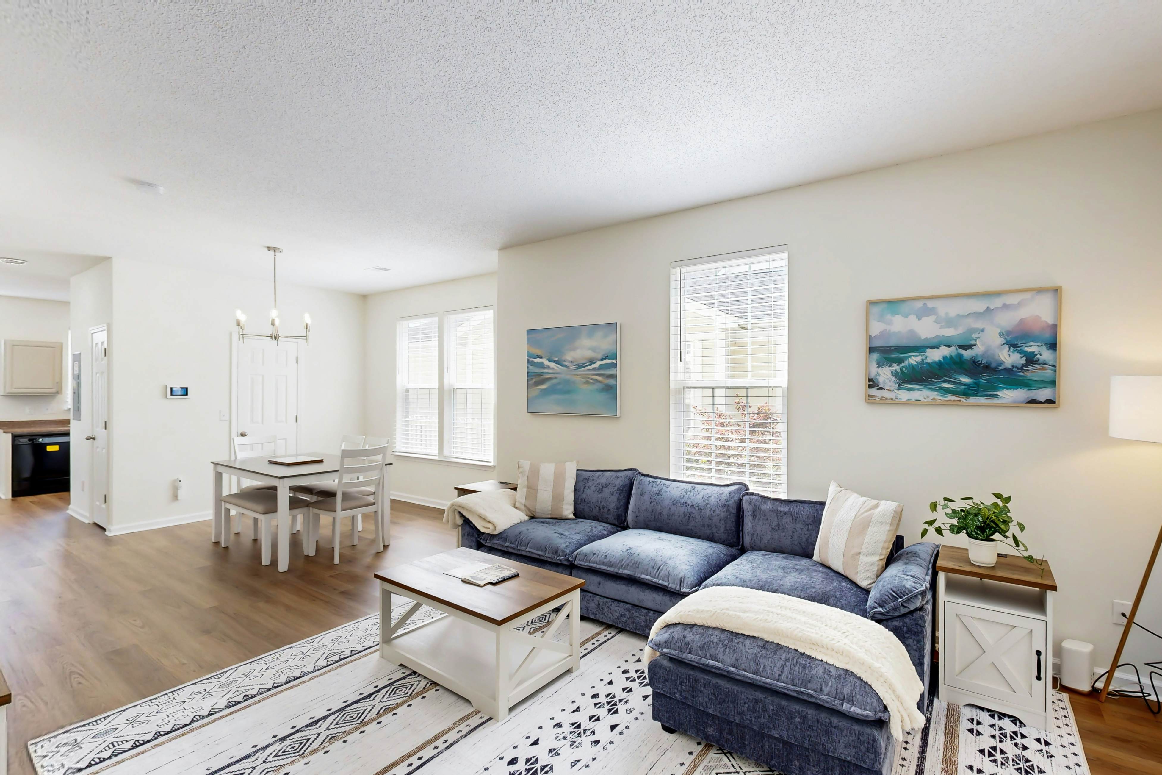 Quintessential townhome with front porch & location near dining & airport