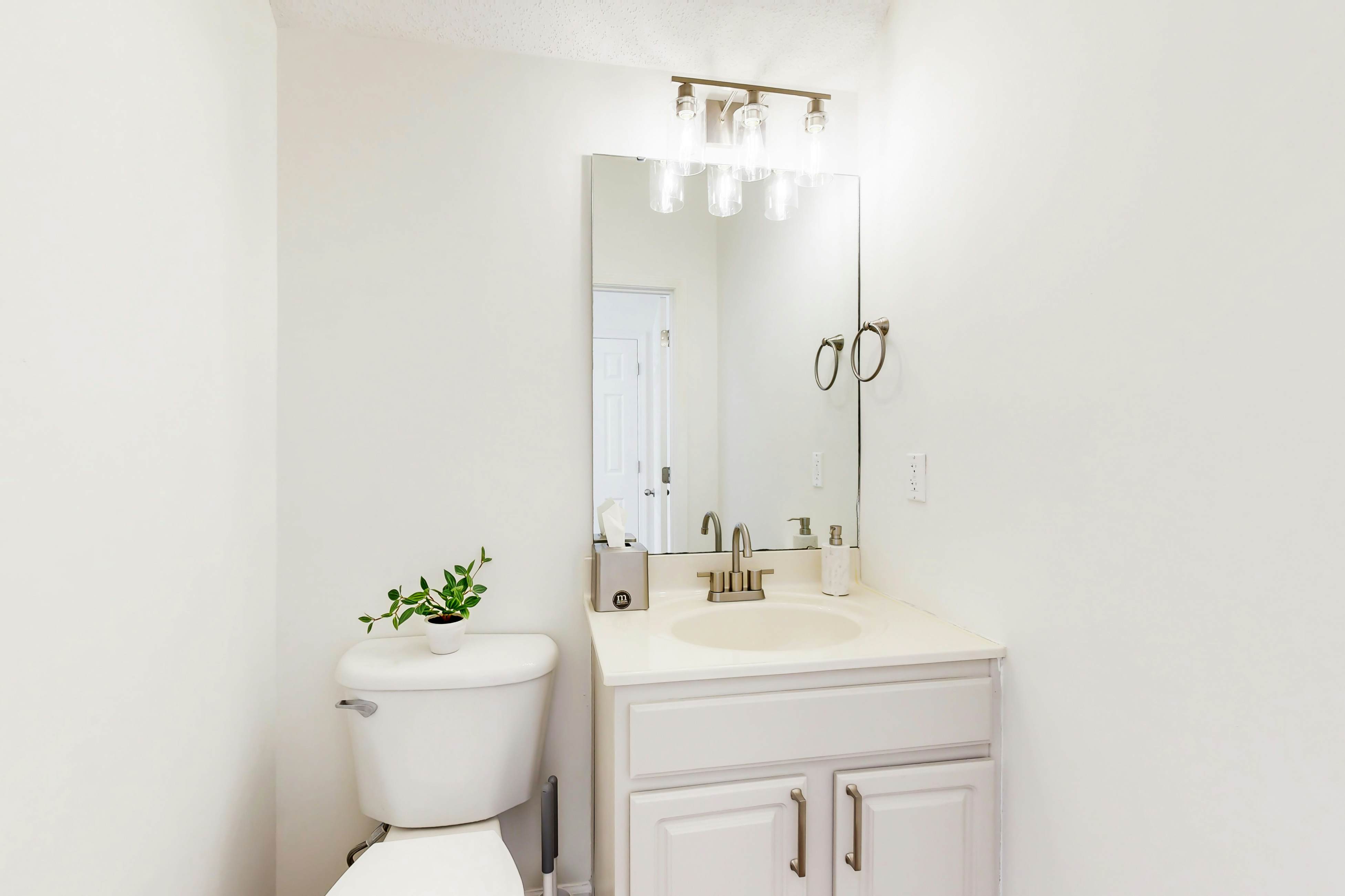 Quintessential townhome with front porch & location near dining & airport