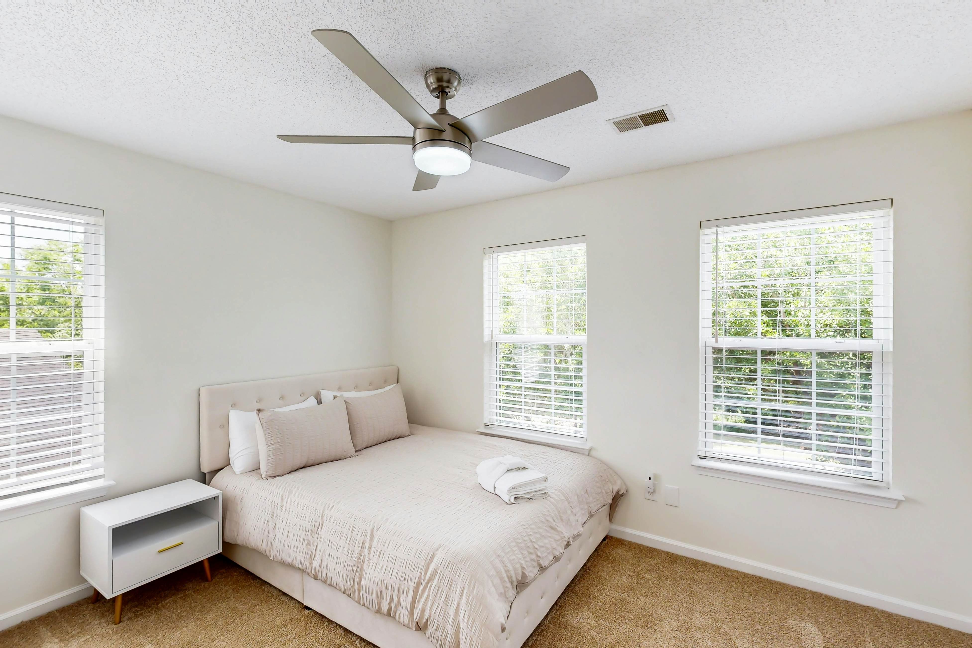 Quintessential townhome with front porch & location near dining & airport