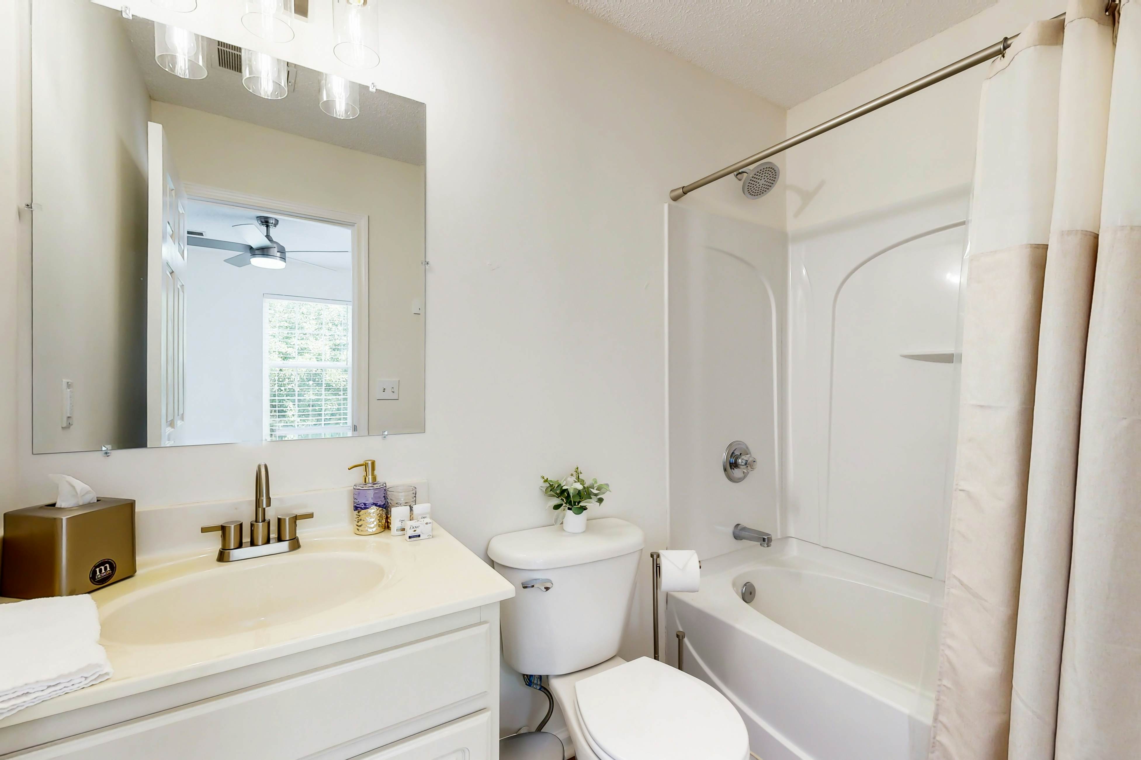 Quintessential townhome with front porch & location near dining & airport