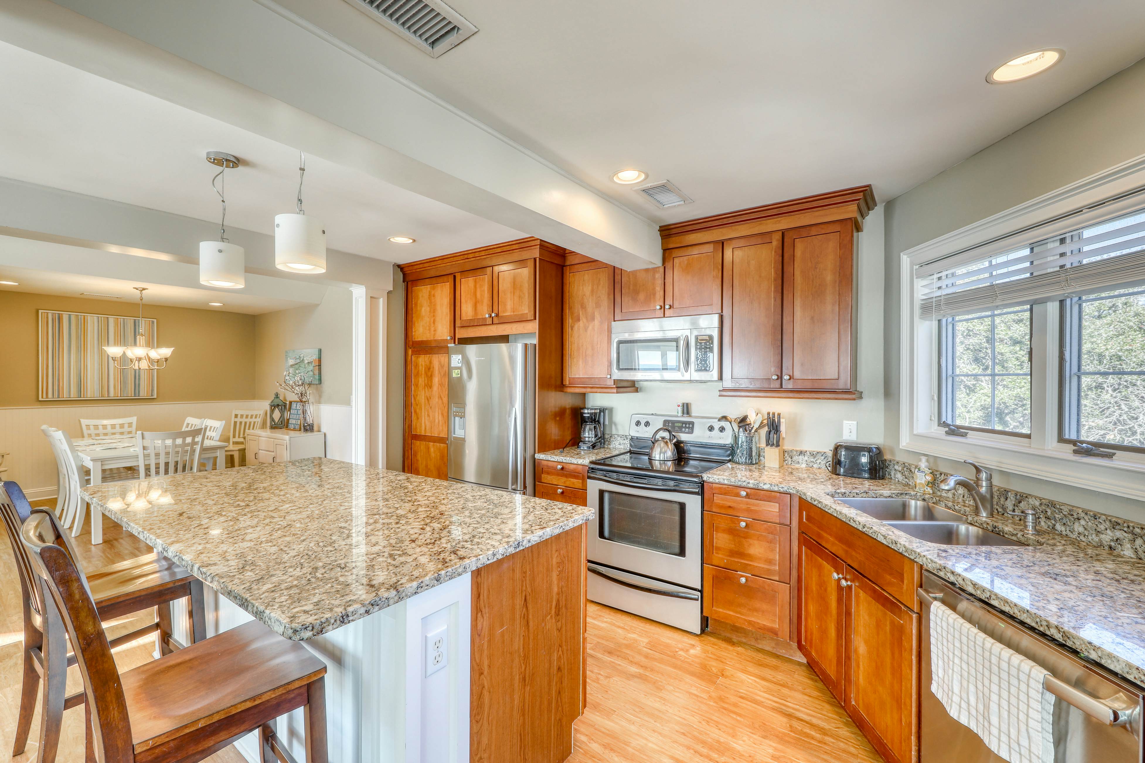 Dog-Friendly Waterfront Condo with Furnished Deck & Beach Views