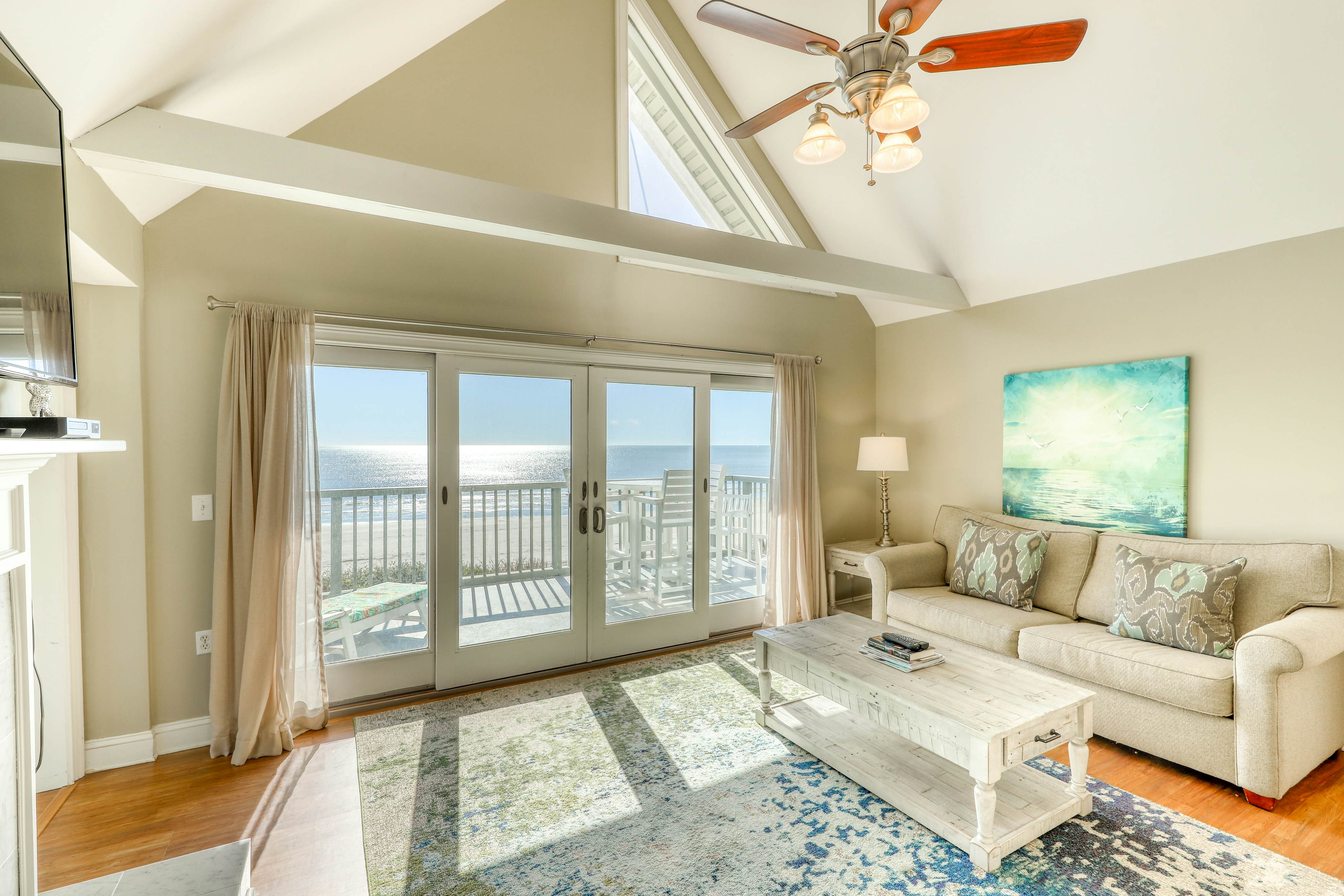 Dog-Friendly Waterfront Condo with Furnished Deck & Beach Views