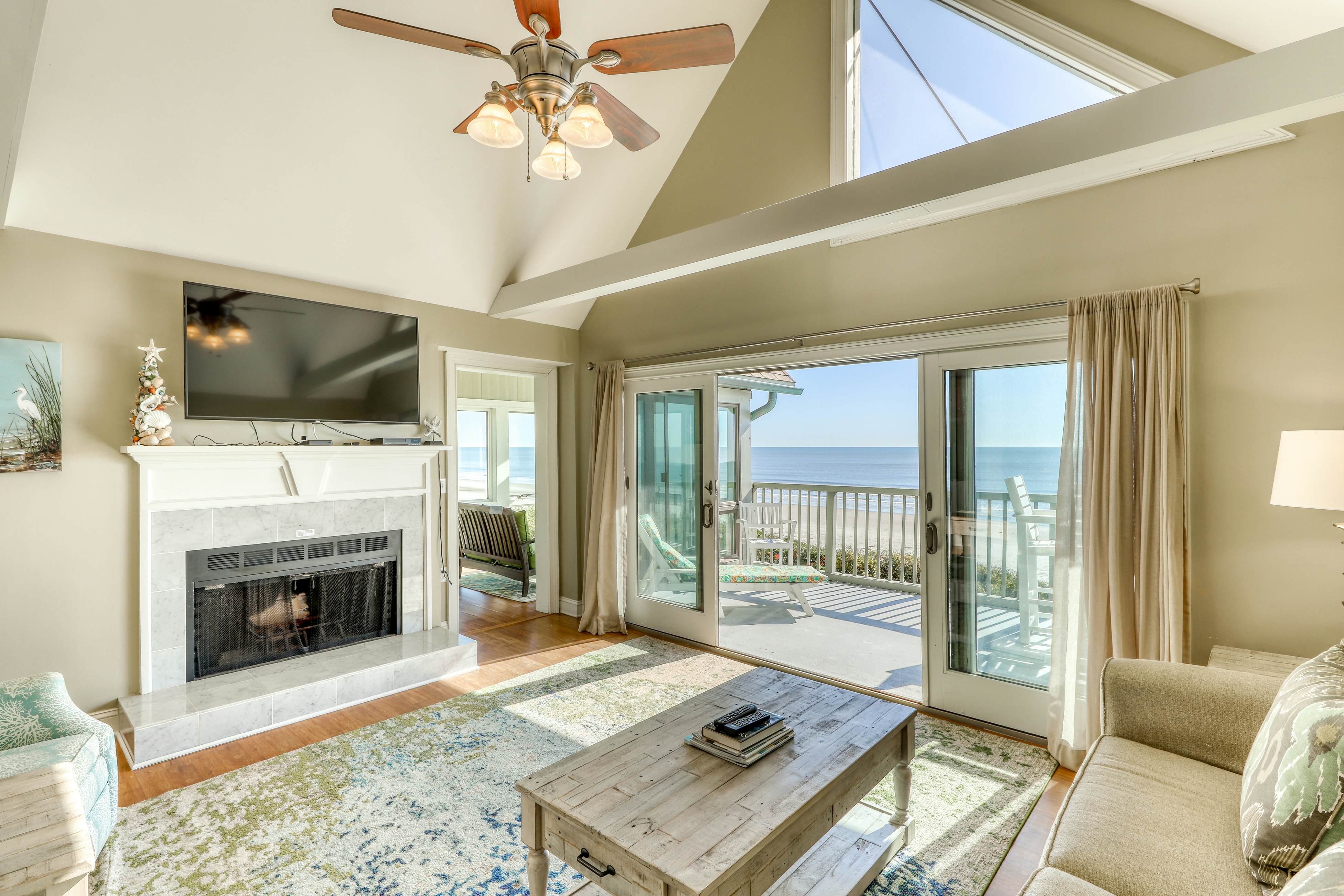 Dog-Friendly Waterfront Condo with Furnished Deck & Beach Views