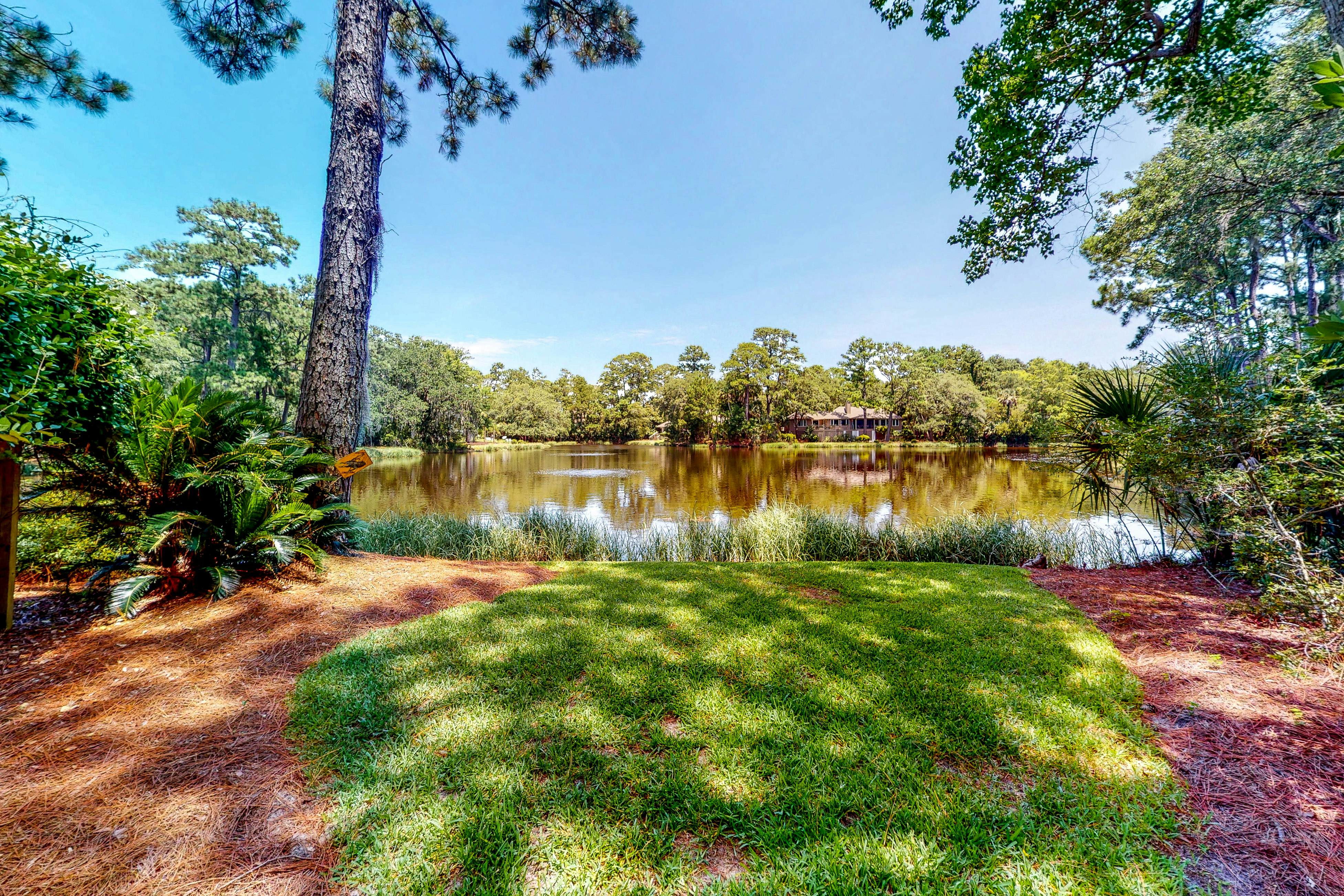 Updated island estate with serene lagoon views & 2 decks - bike to beach