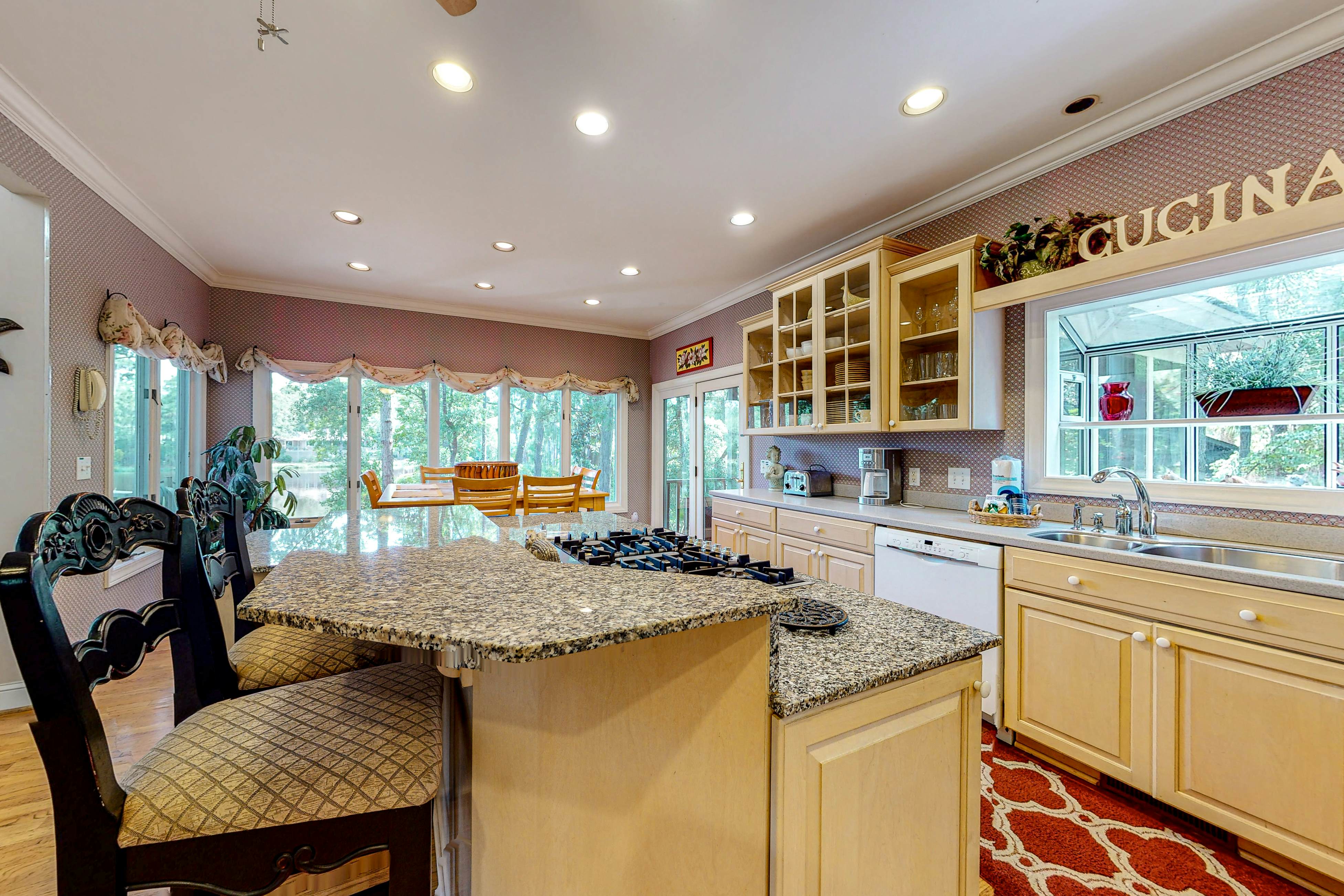 Updated island estate with serene lagoon views & 2 decks - bike to beach