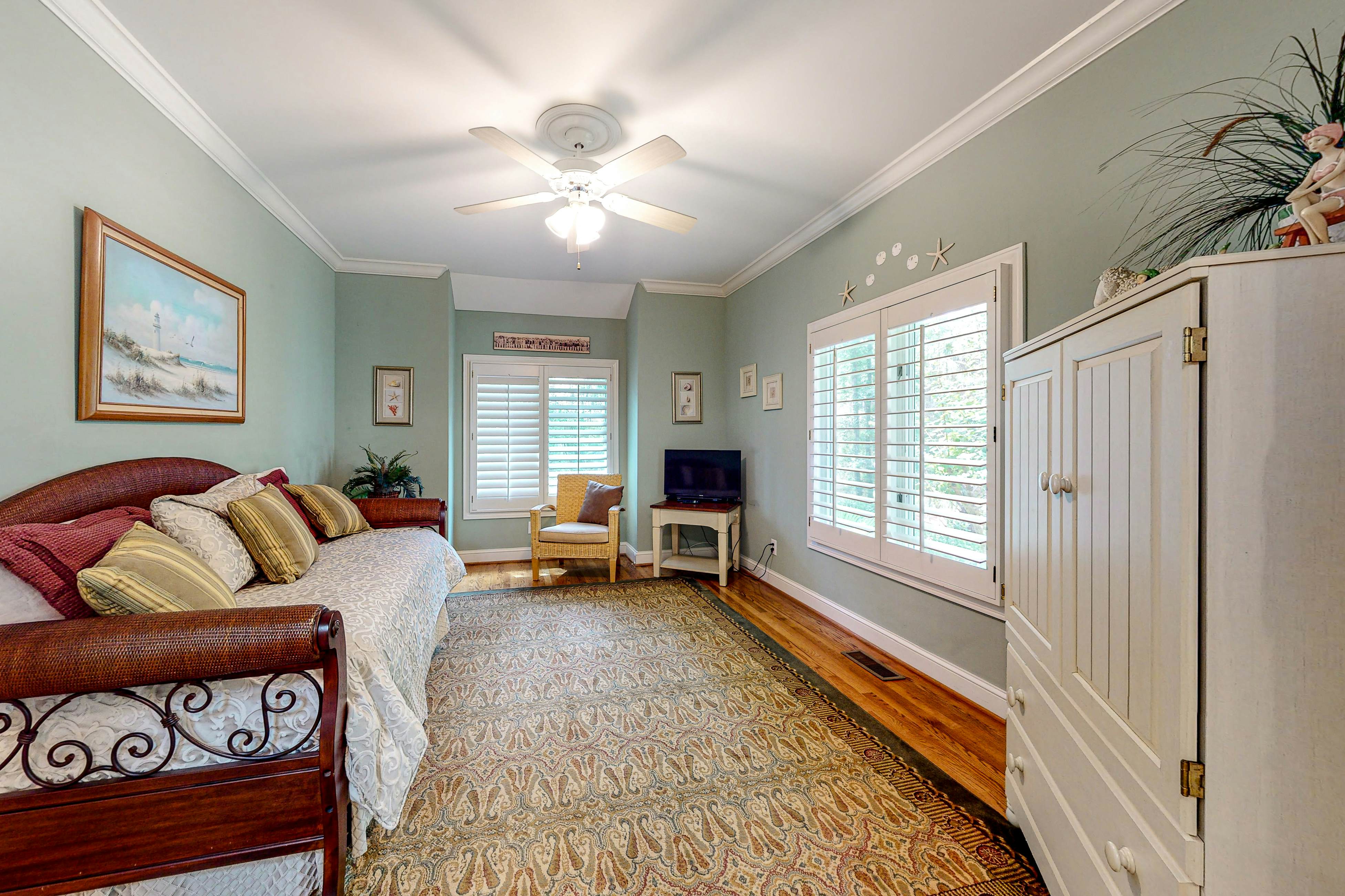 Updated island estate with serene lagoon views & 2 decks - bike to beach