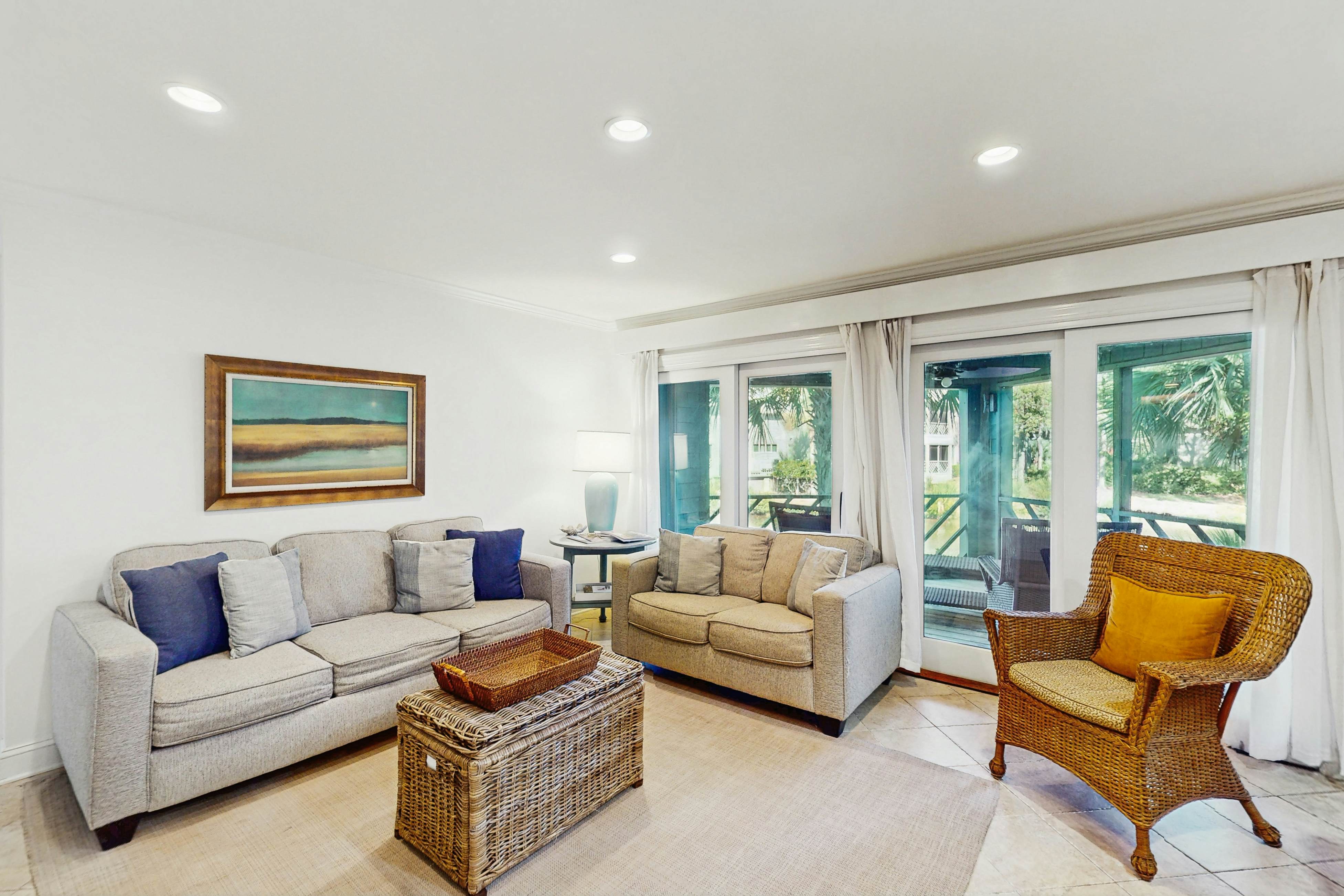 Lagoon-Front Villa w/ Screened Porch, WiFi & AC - Steps to Beach, Tennis & Golf