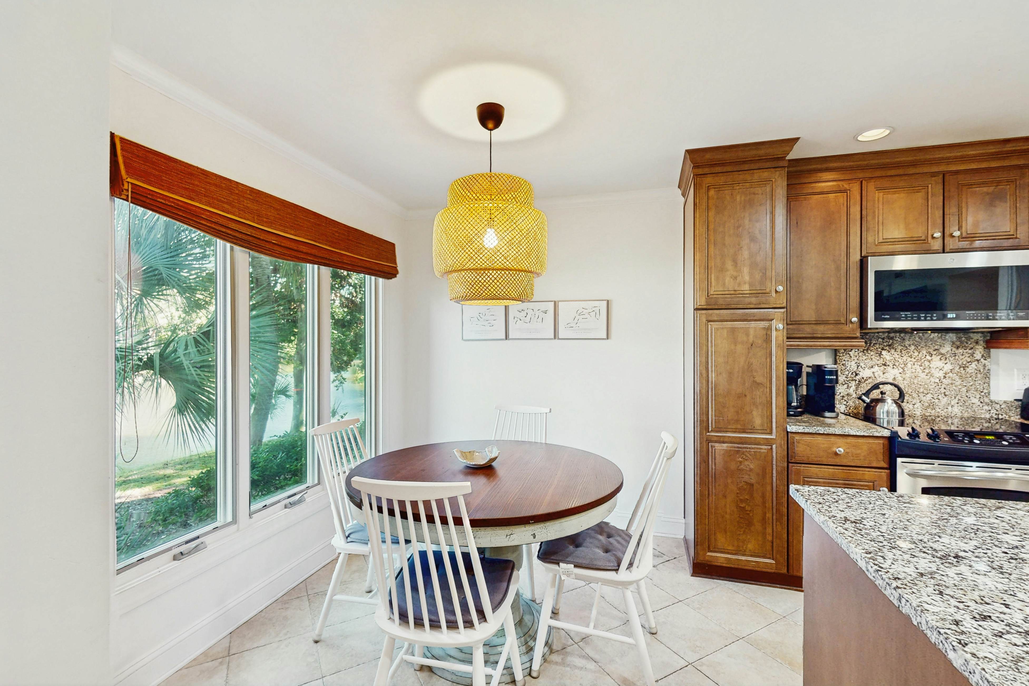 Lagoon-Front Villa w/ Screened Porch, WiFi & AC - Steps to Beach, Tennis & Golf