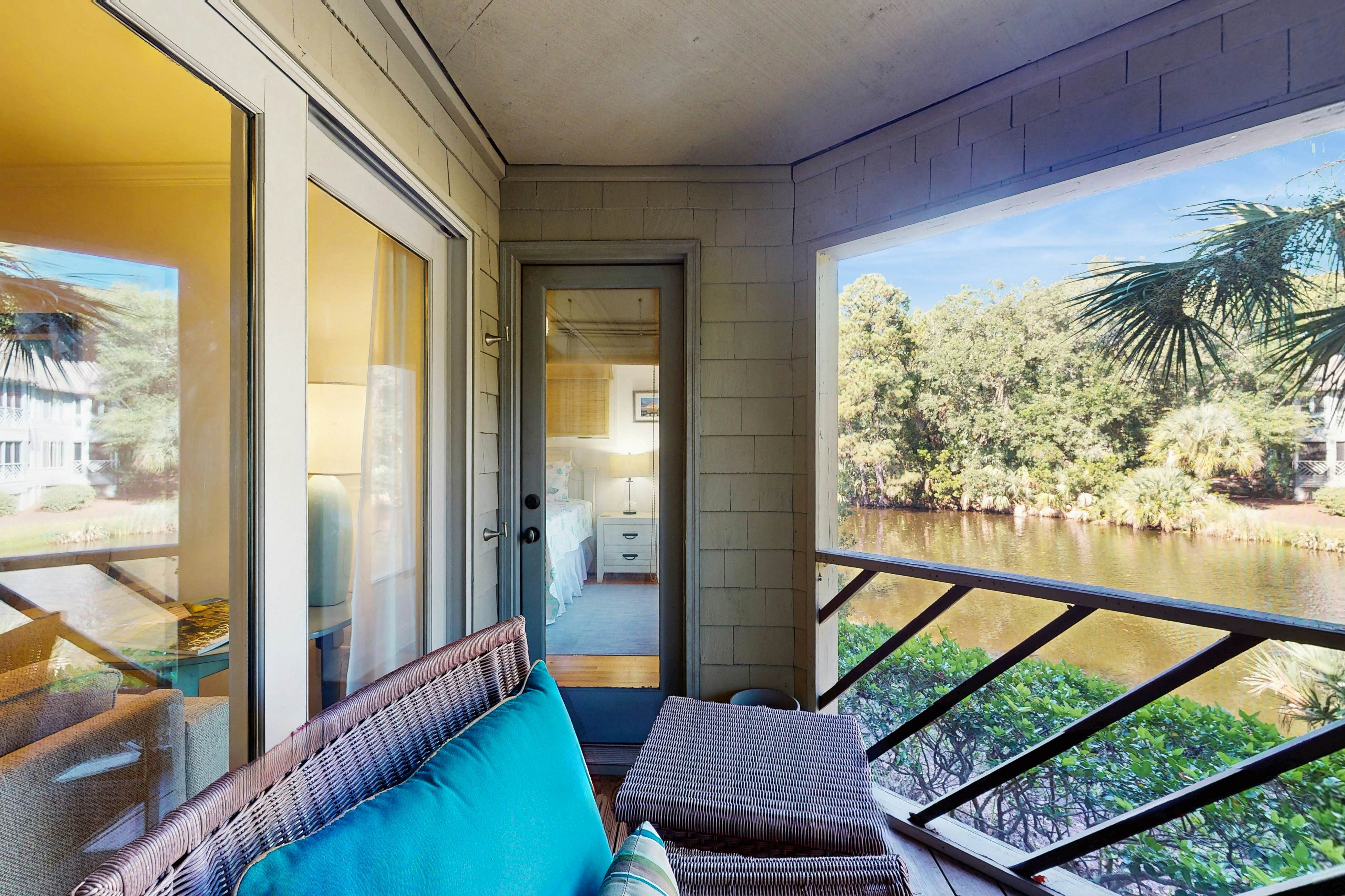 Lagoon-Front Villa w/ Screened Porch, WiFi & AC - Steps to Beach, Tennis & Golf