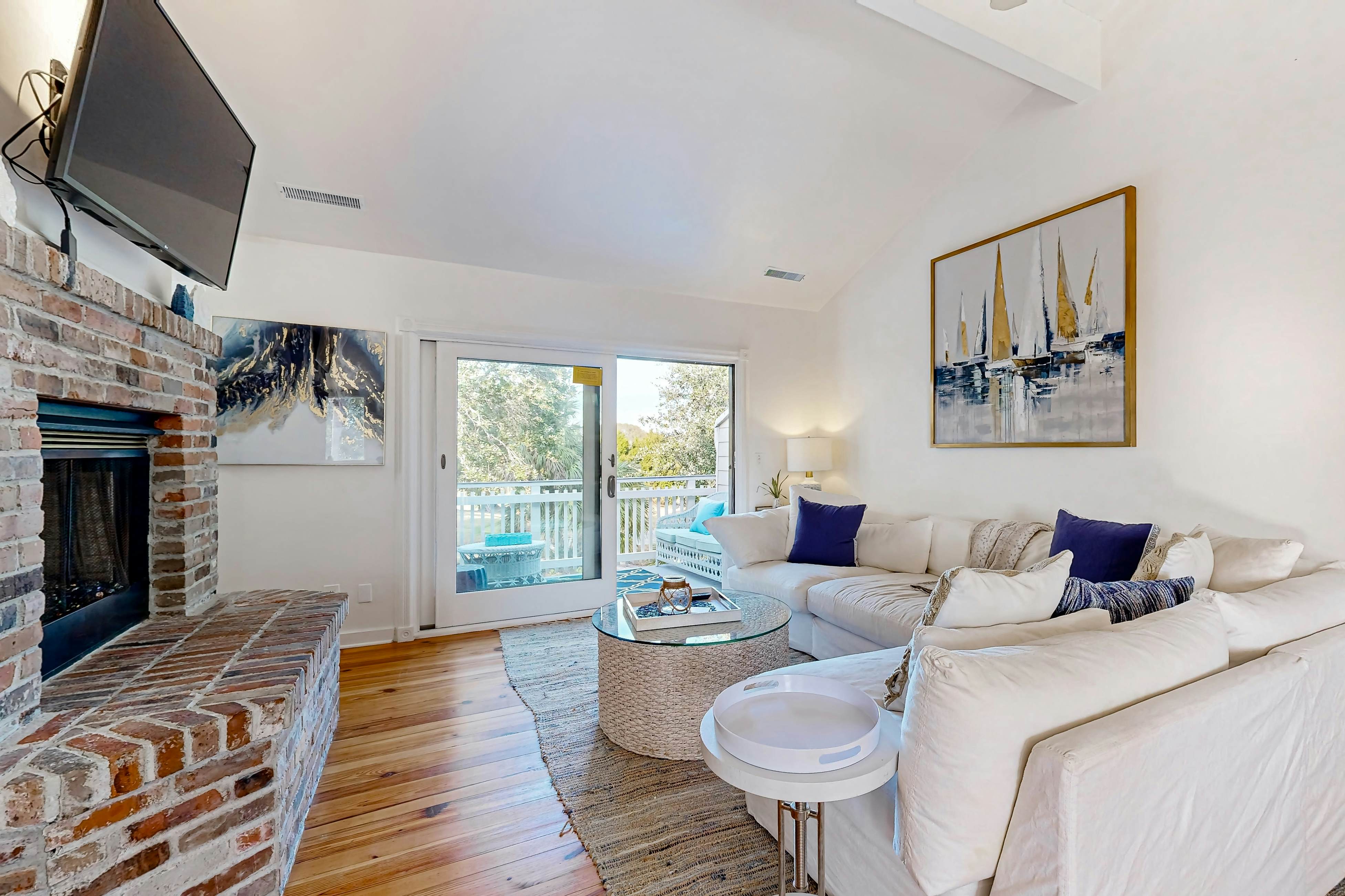 Updated townhouse with outside deck, shared pool, tennis, pickleball and beach