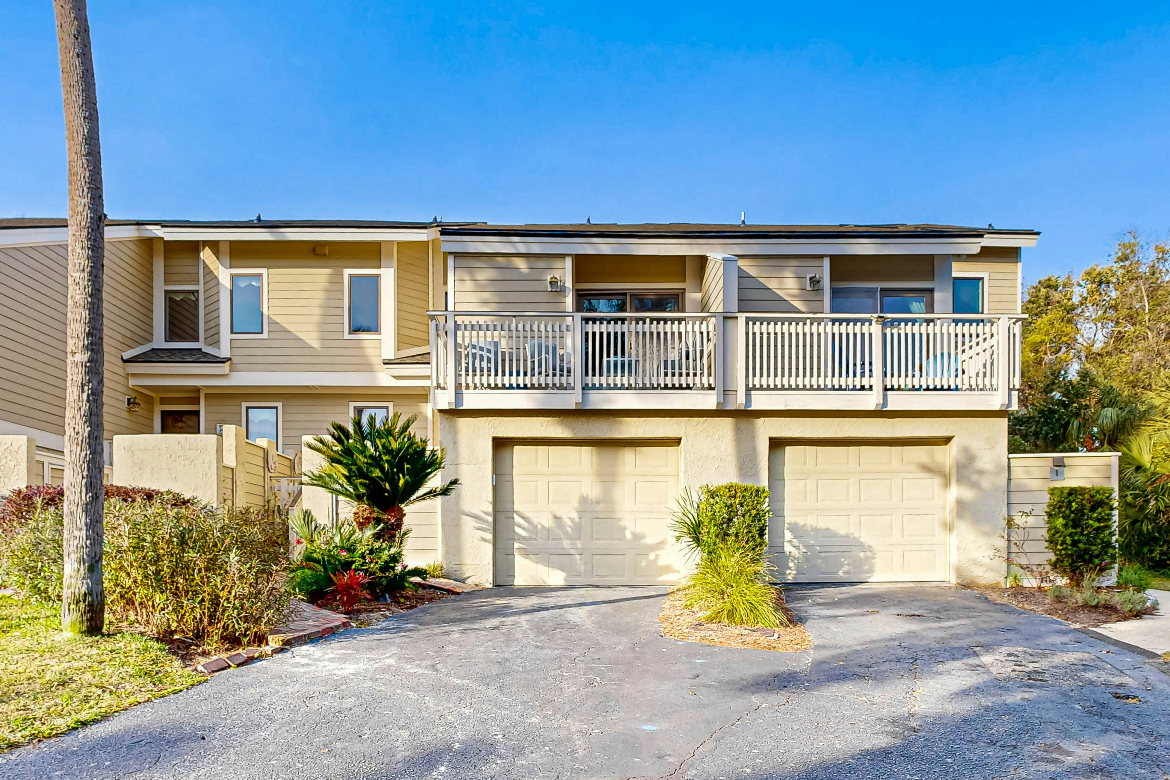 Updated townhouse with outside deck, shared pool, tennis, pickleball and beach