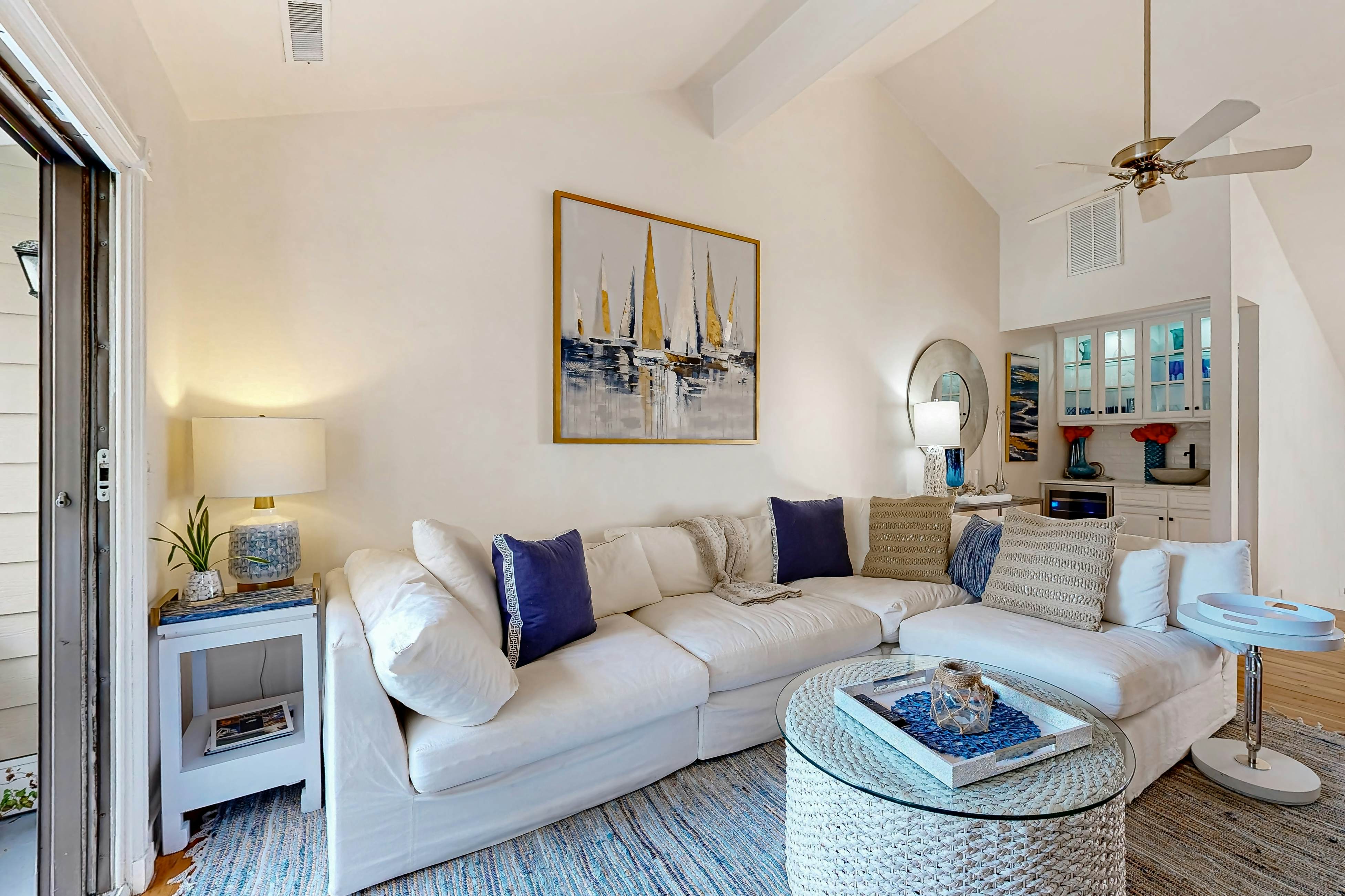 Updated townhouse with outside deck, shared pool, tennis, pickleball and beach