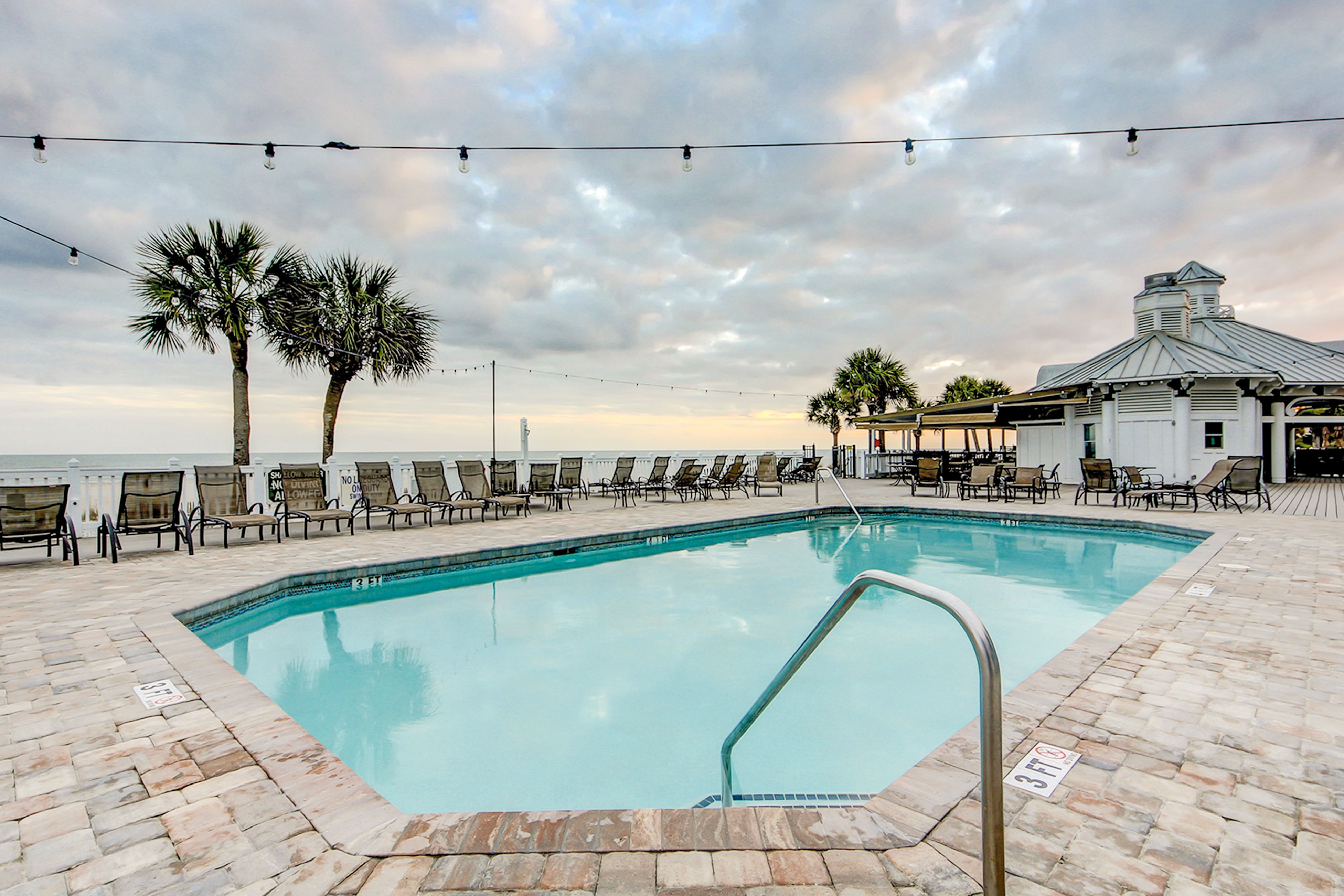 Elegant home on the boardwalk with 2 balconies & shared pools - walk to beach