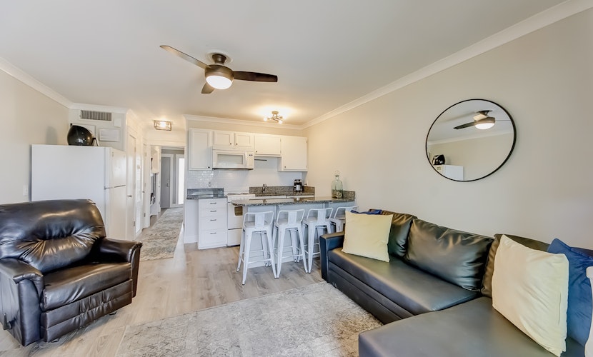 Updated oceanfront condo with balcony, AC, WiFi, pool, pier, & beach access