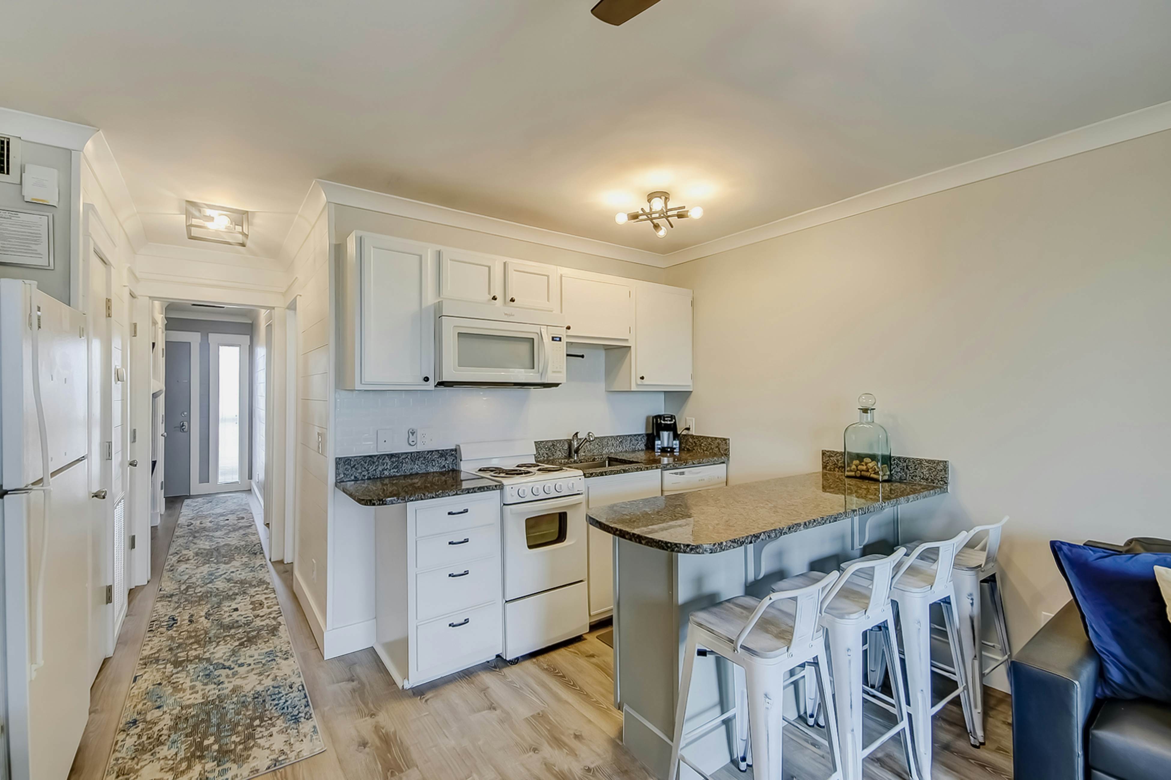 Updated oceanfront condo with balcony, AC, WiFi, pool, pier, & beach access