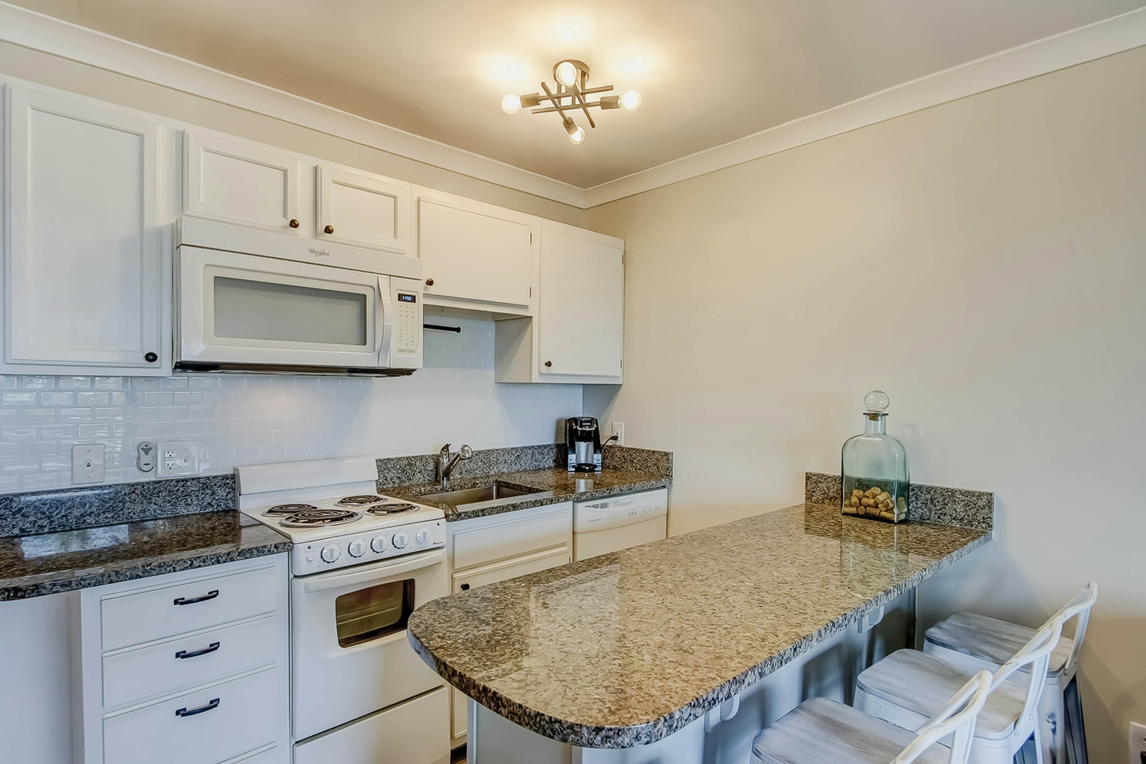 Updated oceanfront condo with balcony, AC, WiFi, pool, pier, & beach access