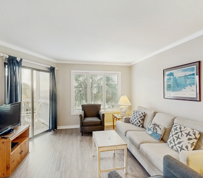 Second-floor villa with lovely ocean views, pickleball, pool & screened deck