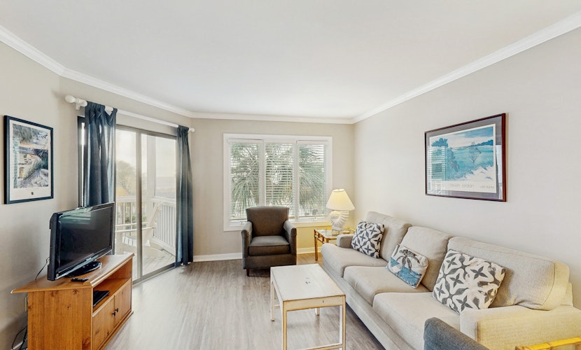 Second-floor villa with lovely ocean views, pickleball, pool & screened deck