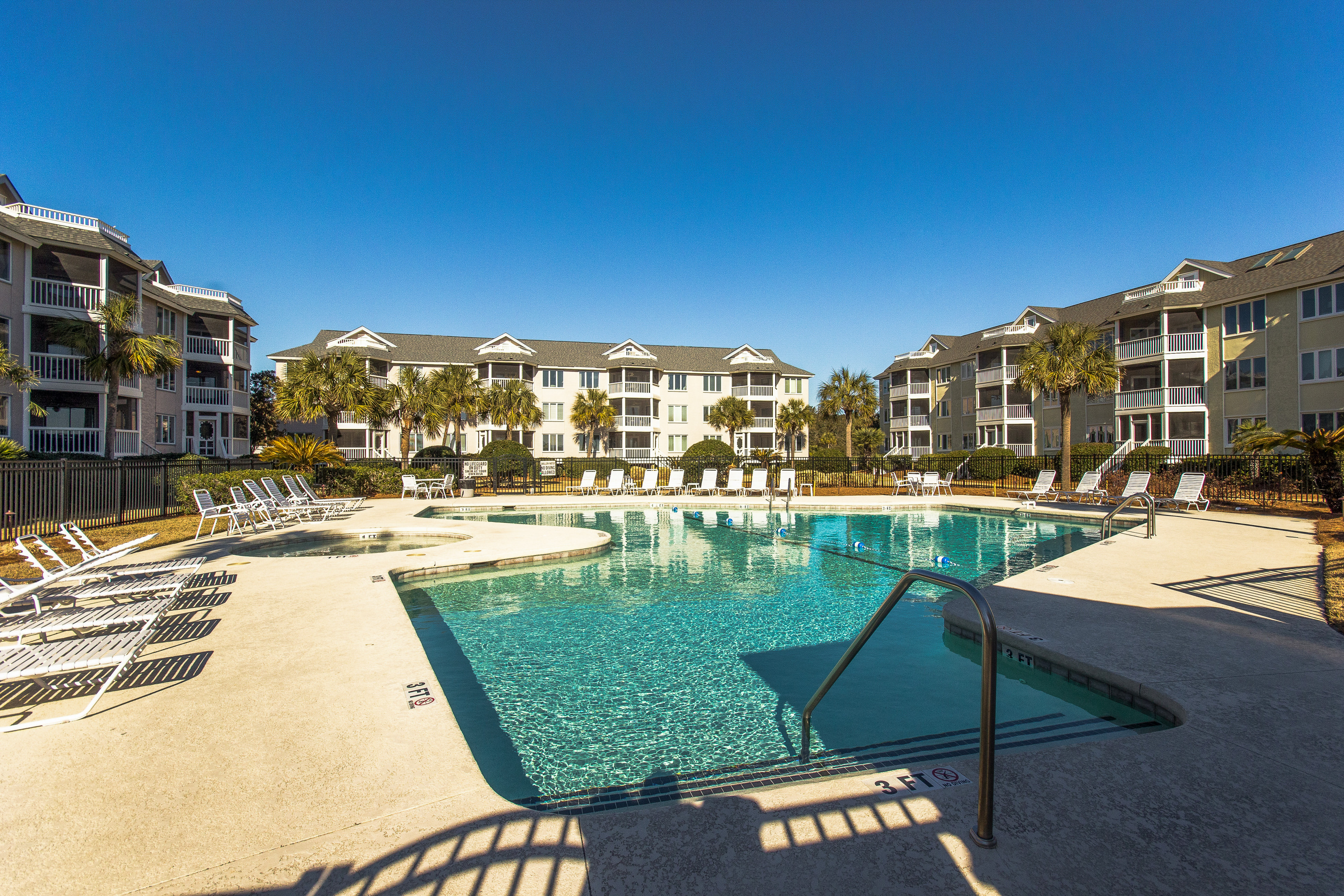 Second-floor villa with lovely ocean views, pickleball, pool & screened deck