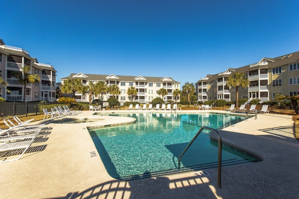 Second-floor villa with lovely ocean views, pickleball, pool & screened deck