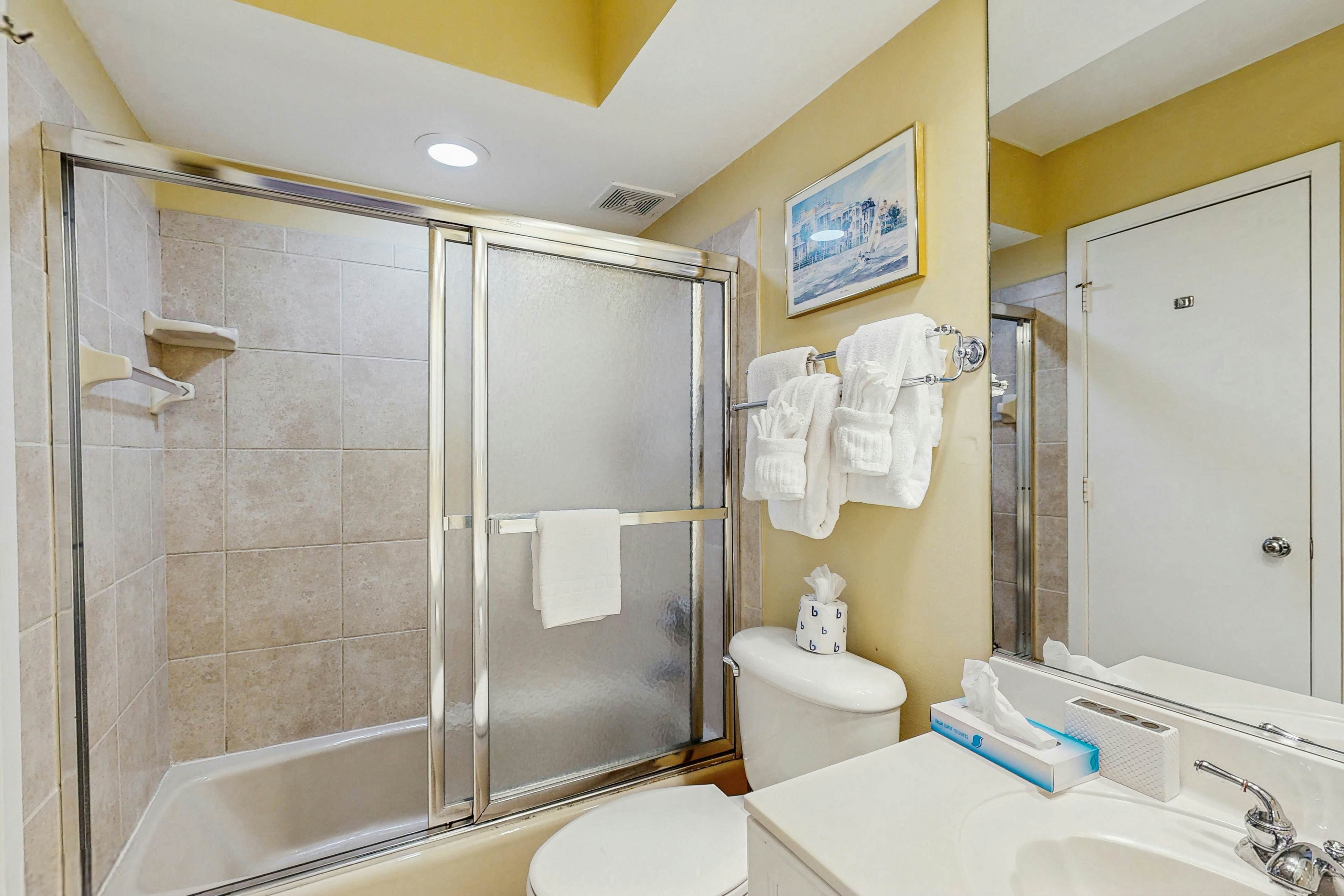 Second-floor villa with lovely ocean views, pickleball, pool & screened deck