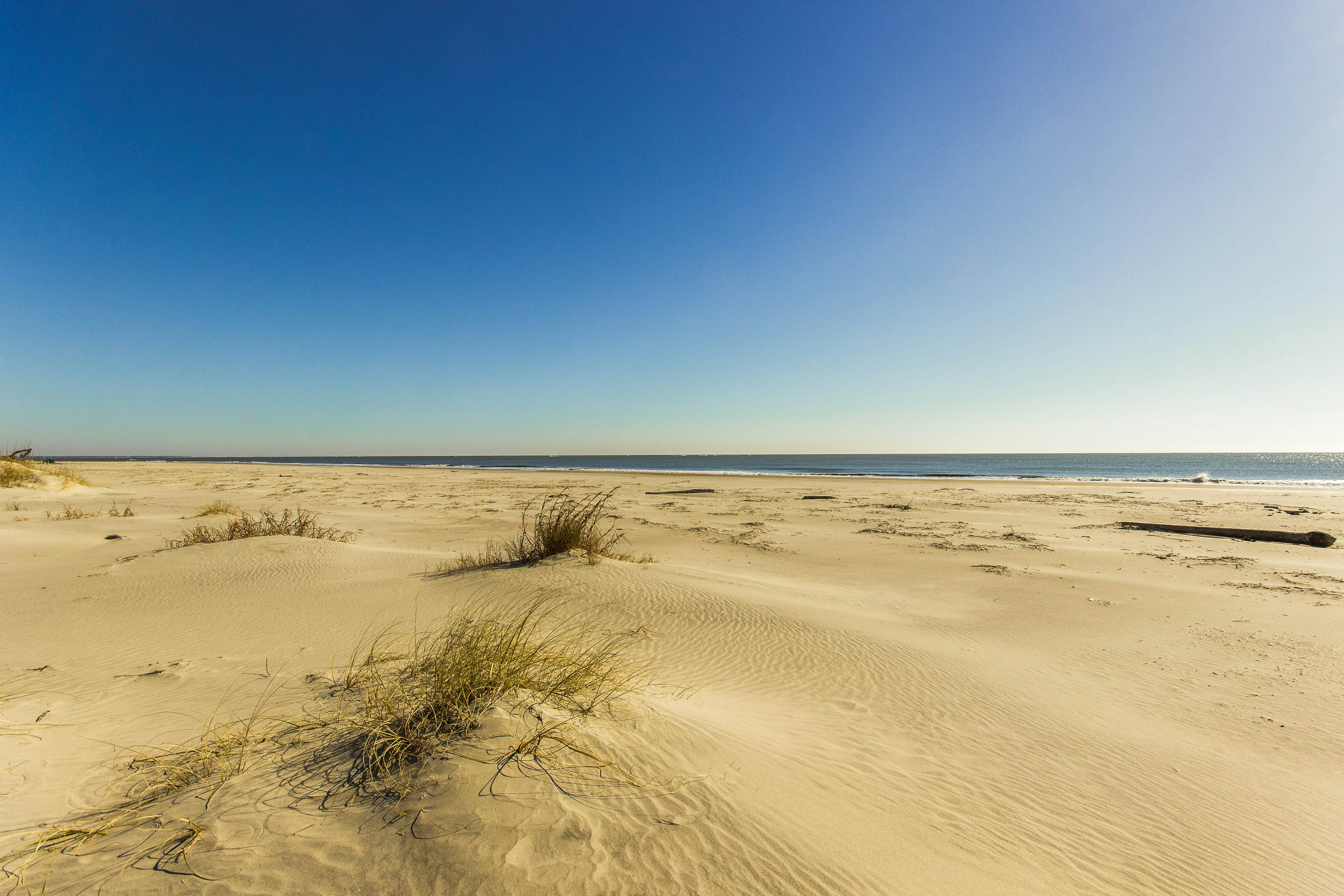 Second-floor villa with lovely ocean views, pickleball, pool & screened deck