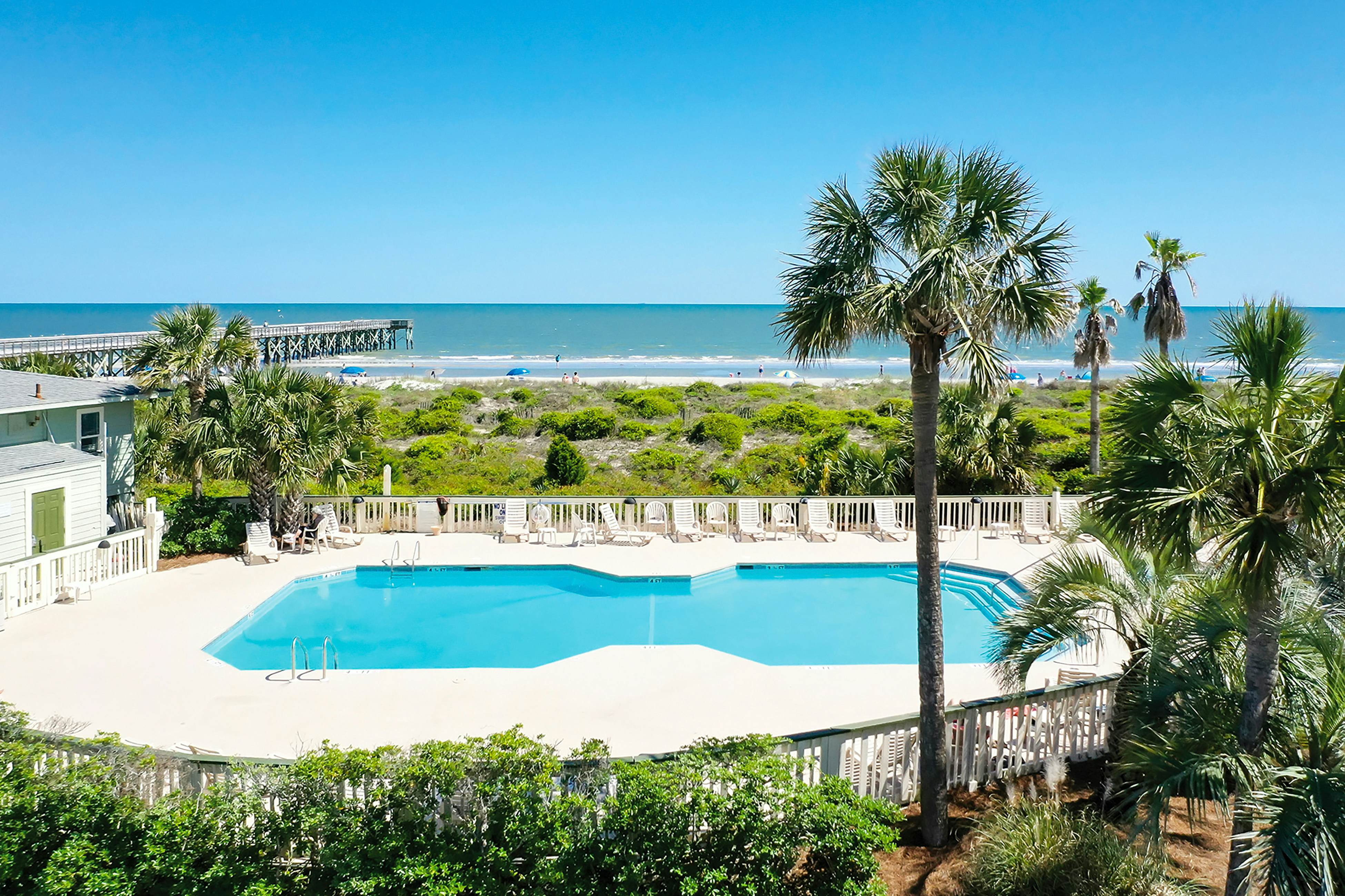 Beachfront condo with pool, beach access, pier, private balcony, & central AC