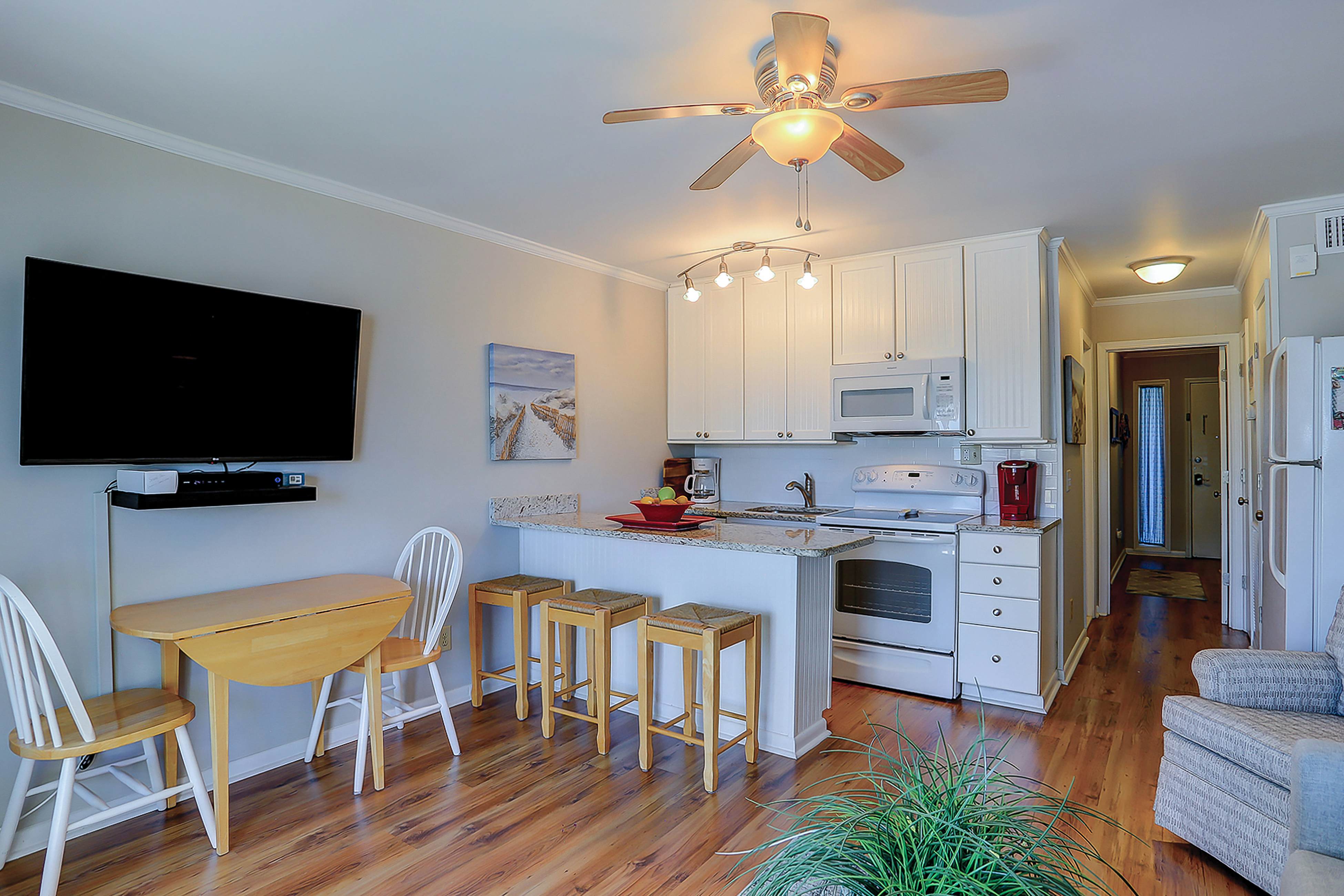 Beachfront condo with pool, beach access, pier, private balcony, & central AC