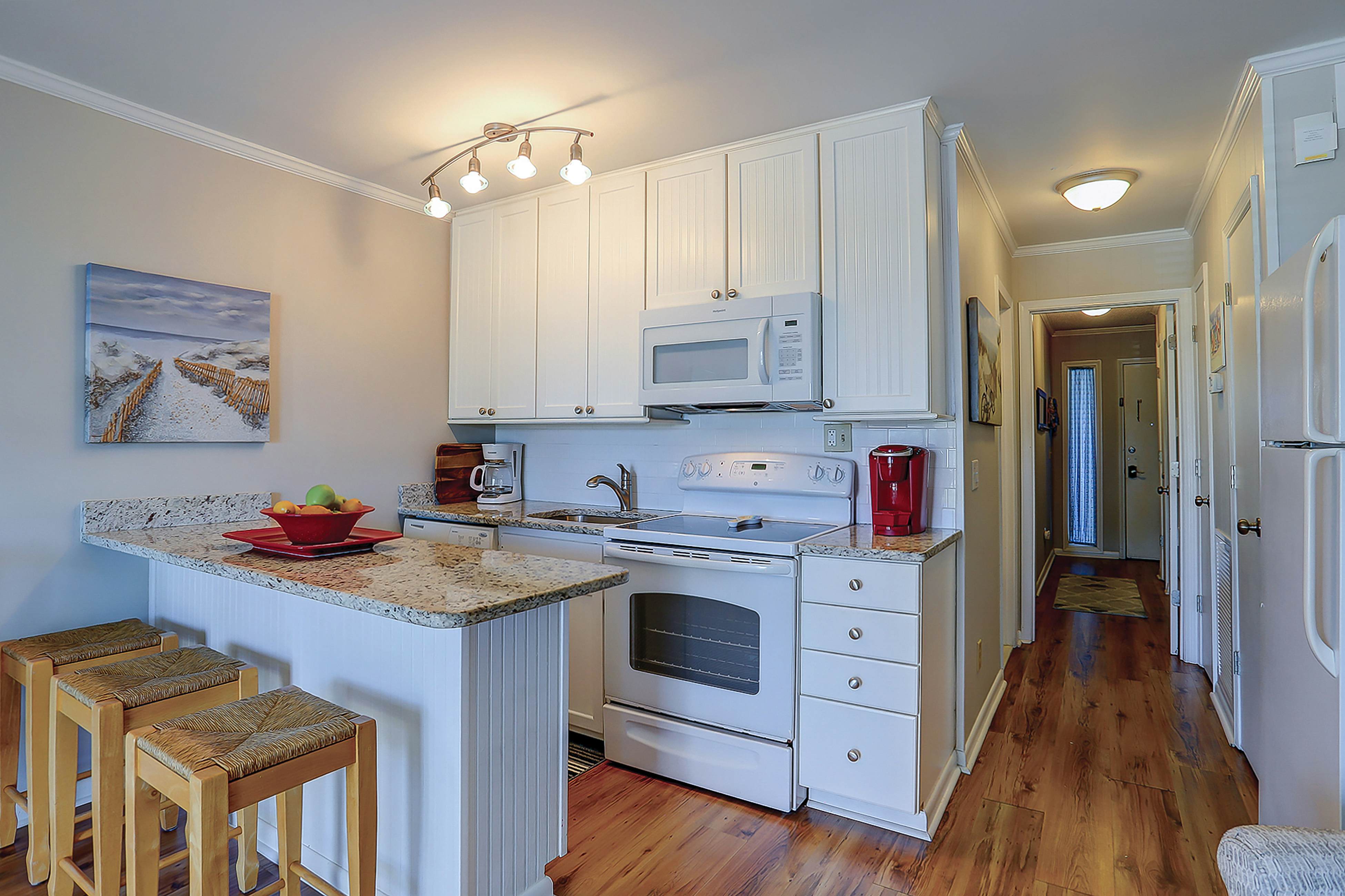 Beachfront condo with pool, beach access, pier, private balcony, & central AC