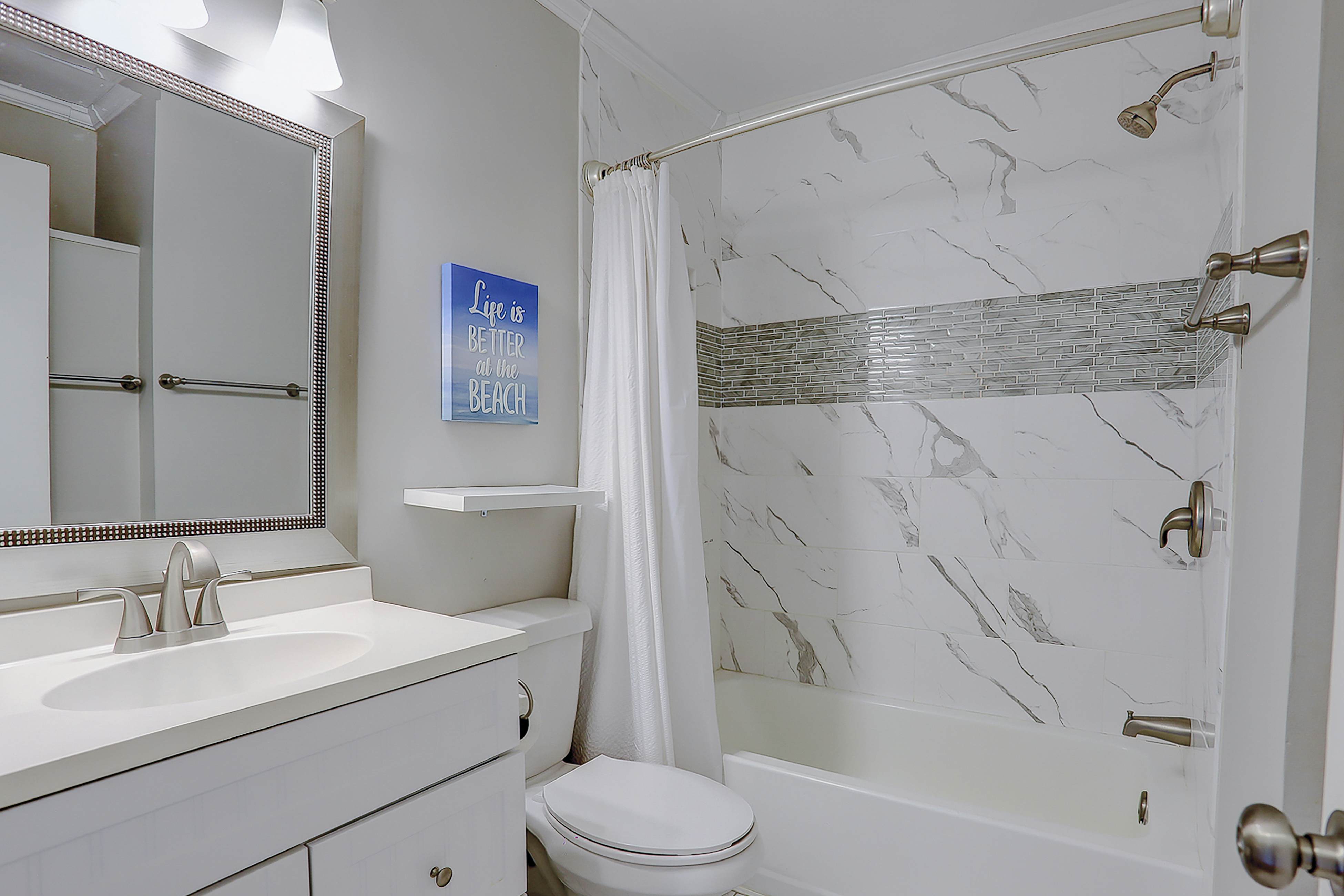 Beachfront condo with pool, beach access, pier, private balcony, & central AC