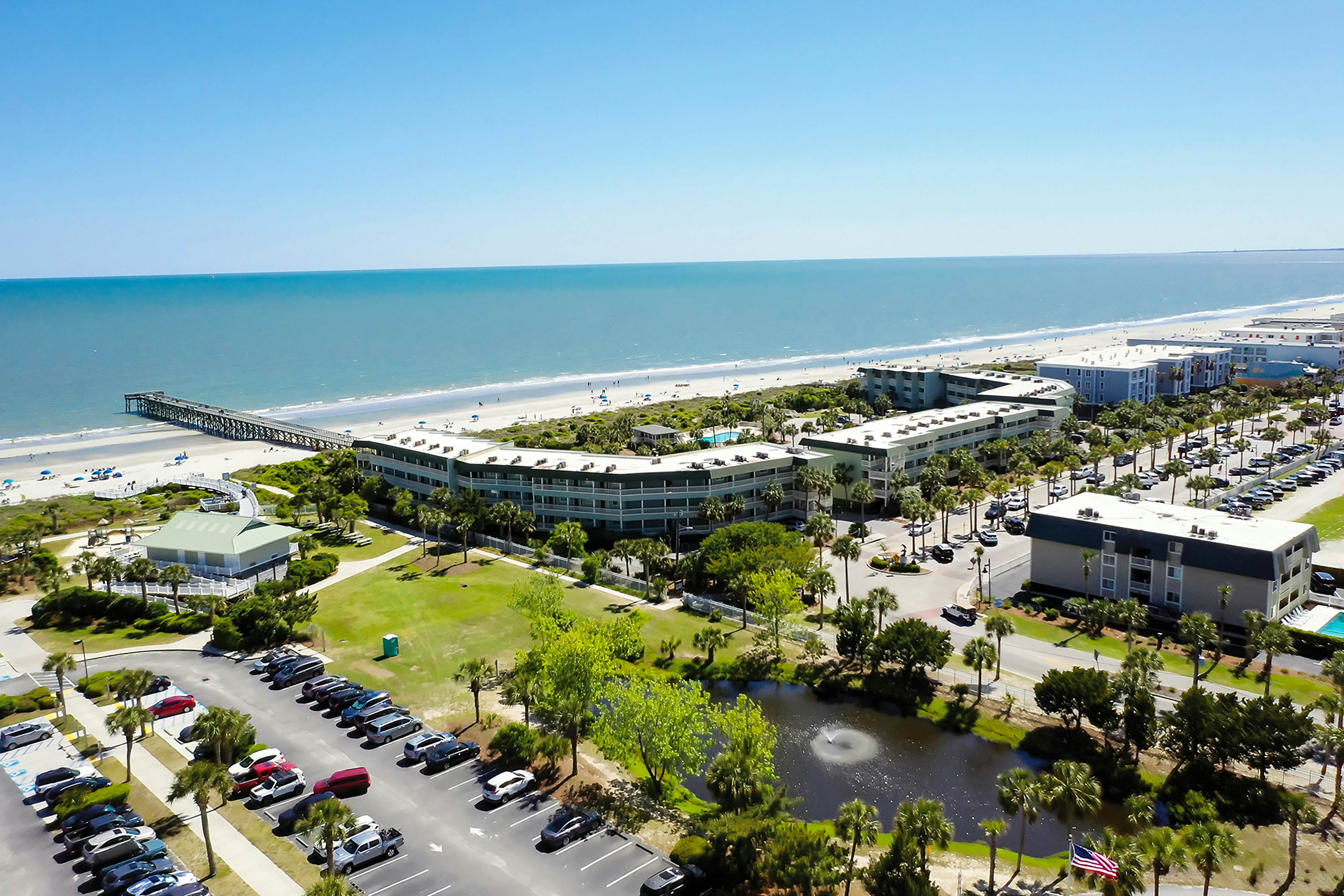 Beachfront condo with pool, beach access, pier, private balcony, & central AC