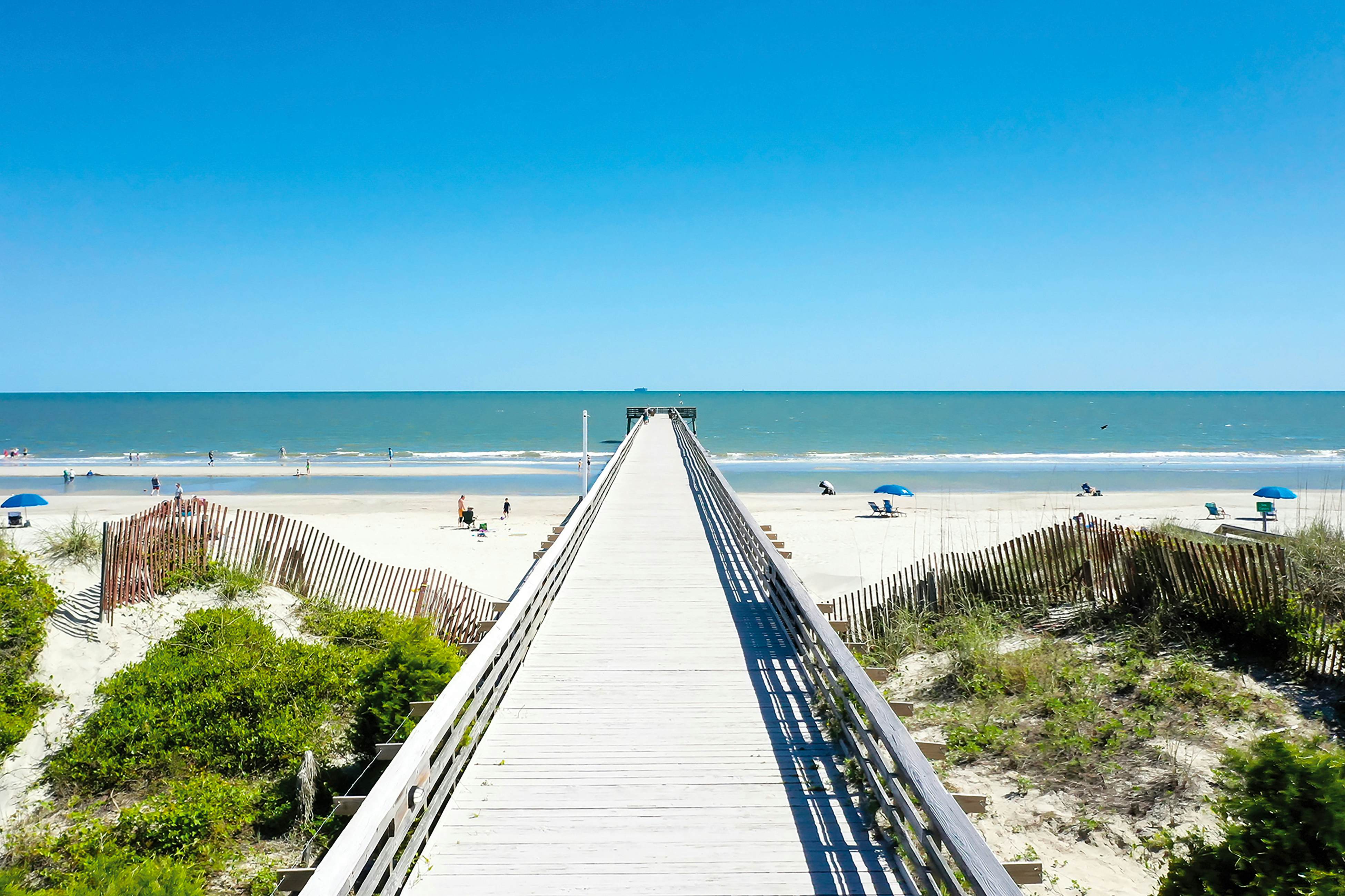 Beachfront condo with pool, beach access, pier, private balcony, & central AC