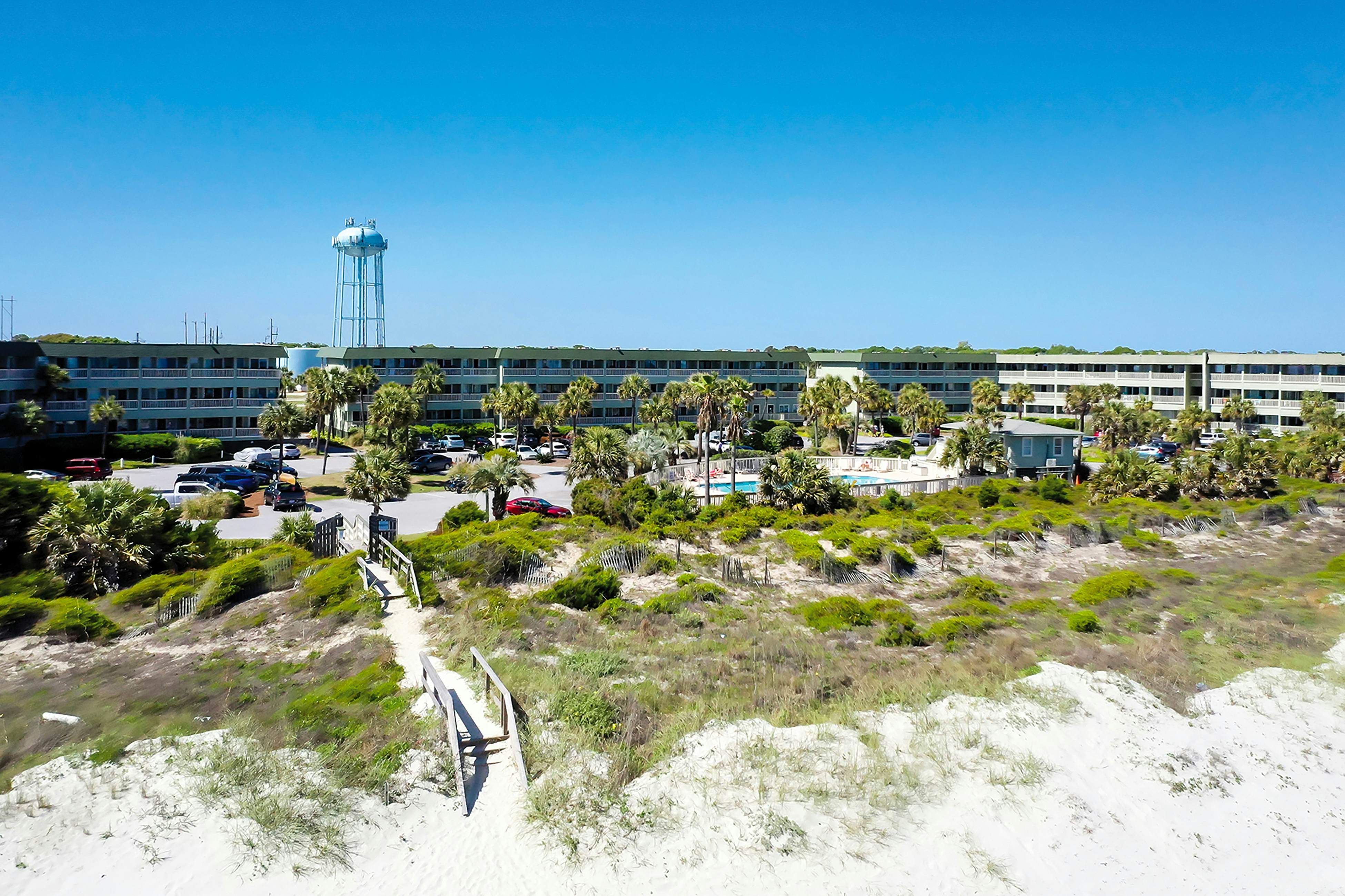 Beachfront condo with pool, beach access, pier, private balcony, & central AC