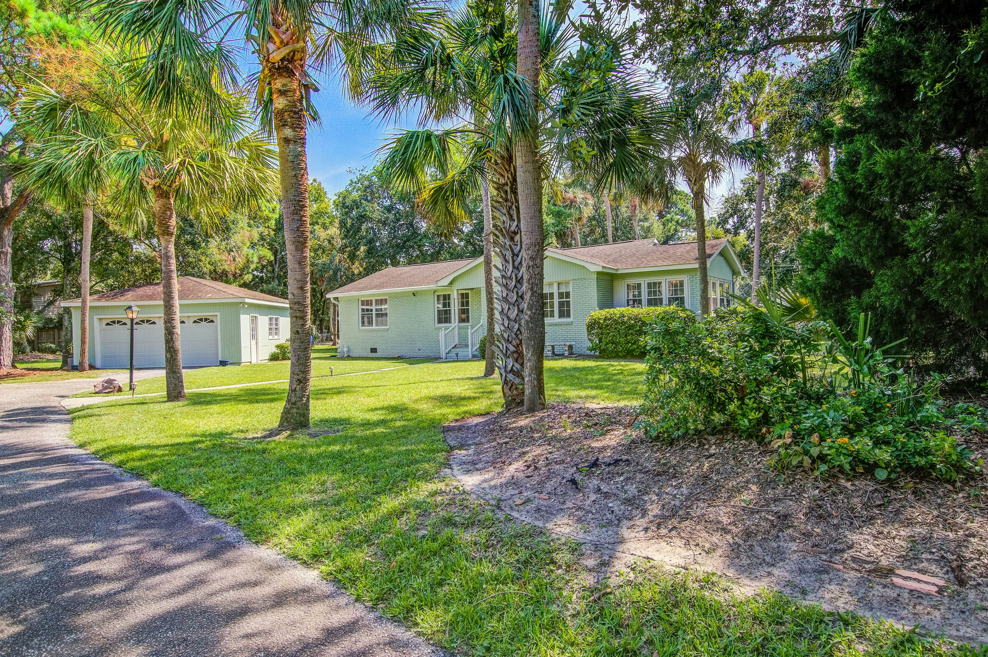Refined coastal home surrounded by palms with large deck & athletic court access
