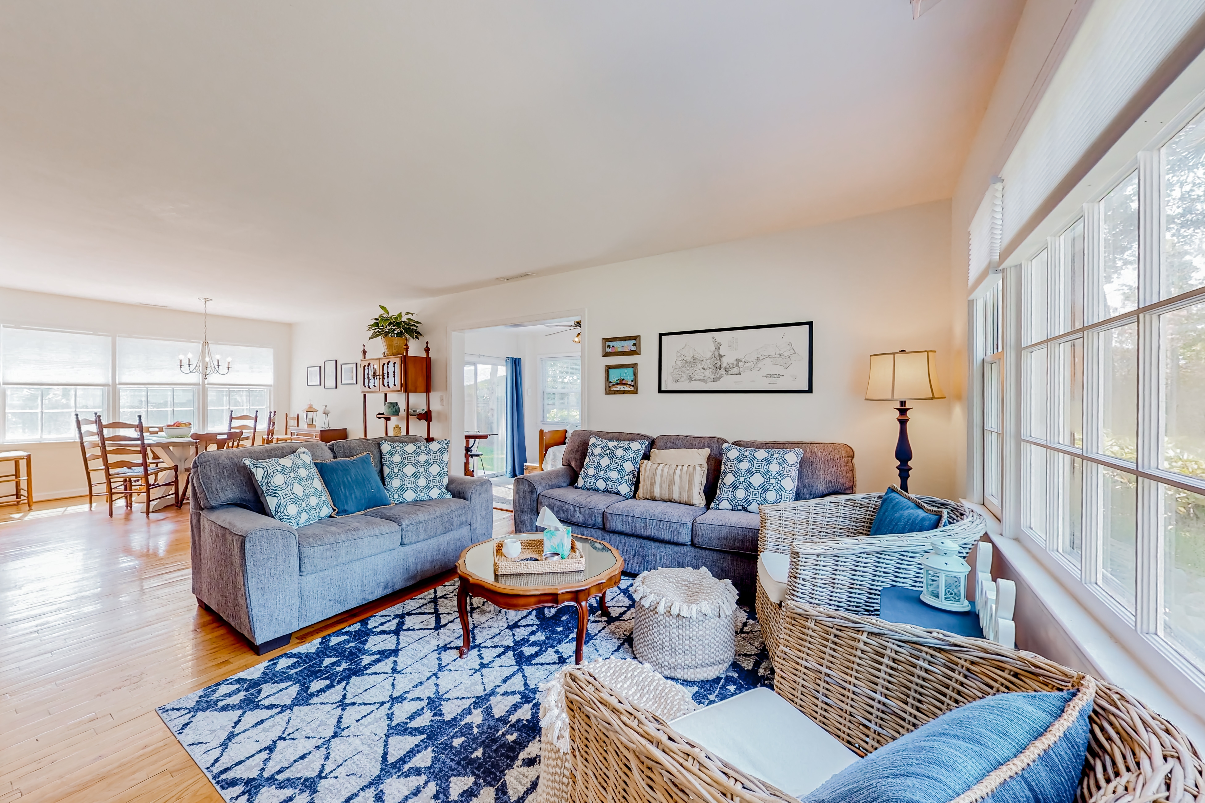 Refined coastal home surrounded by palms with large deck & athletic court access