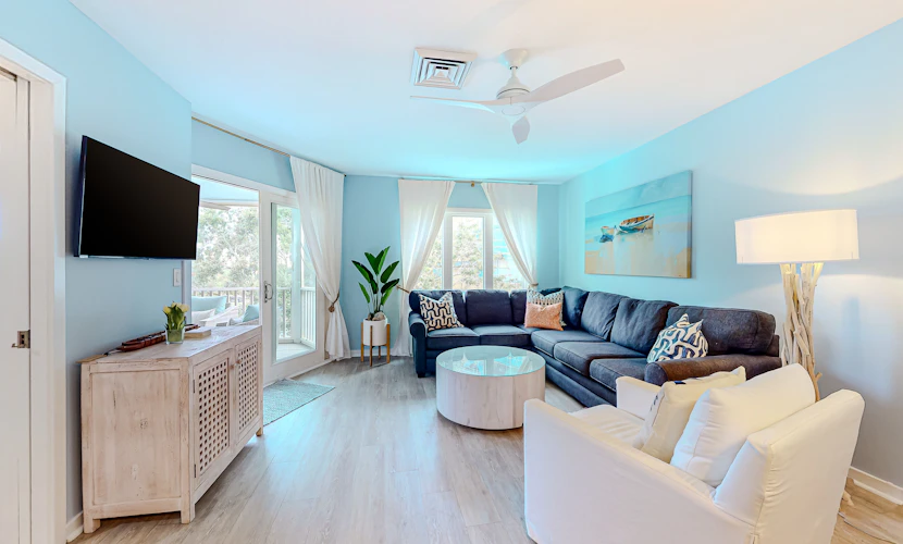 Two-story condo near beach with on-site pool & screened deck