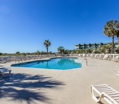 Oceanfront condo with water views, pool, balcony, & easy beach access
