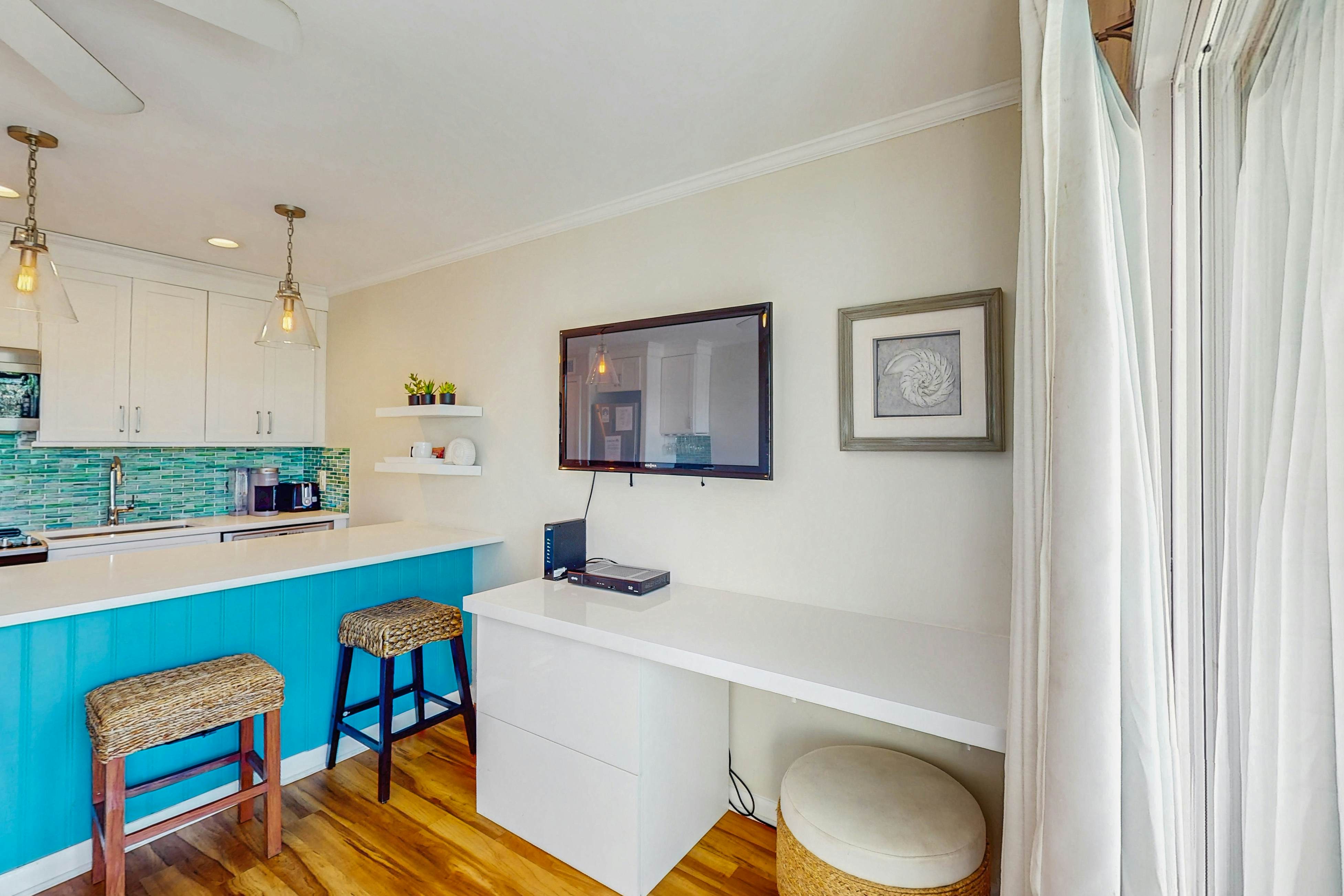 Oceanfront condo with water views, pool, balcony, & easy beach access